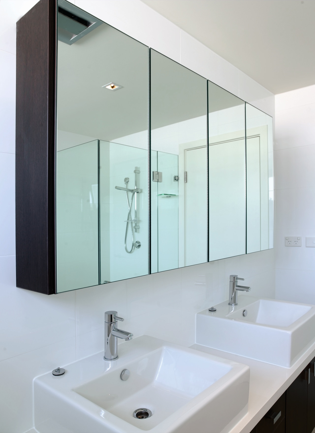 A view of this bathroom dual basins, mirror bathroom, bathroom accessory, bathroom cabinet, bathroom sink, glass, interior design, plumbing fixture, product design, sink, tap, gray, white