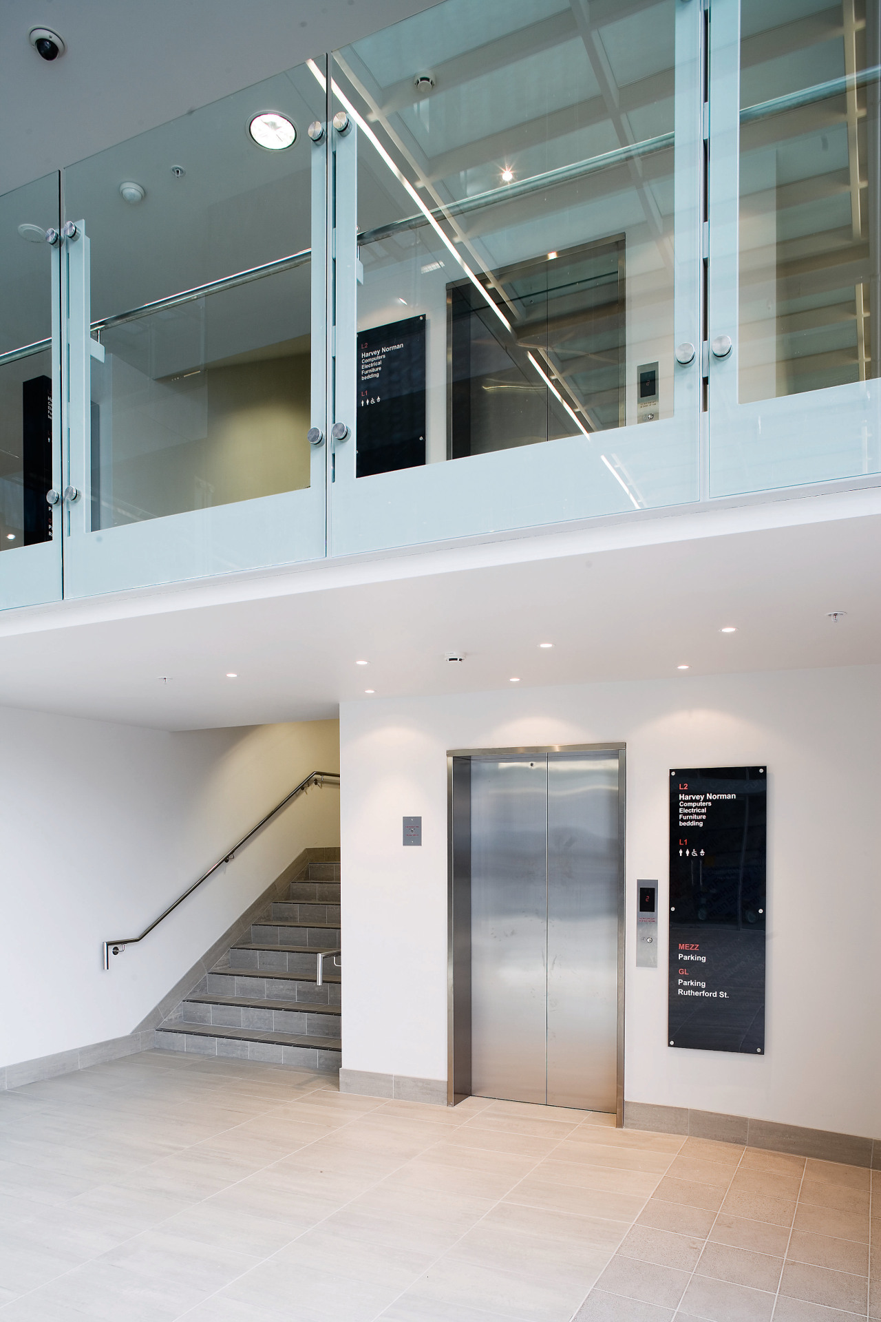 A vie wof  an elevator within the architecture, daylighting, glass, interior design, gray, white