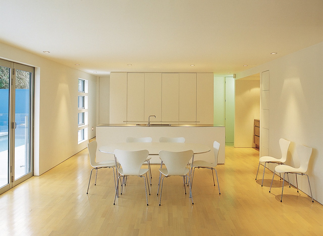 An interior view of the living areas featuring apartment, architecture, ceiling, chair, daylighting, dining room, floor, flooring, hardwood, home, house, interior design, laminate flooring, property, real estate, room, table, wall, window, wood, wood flooring, orange