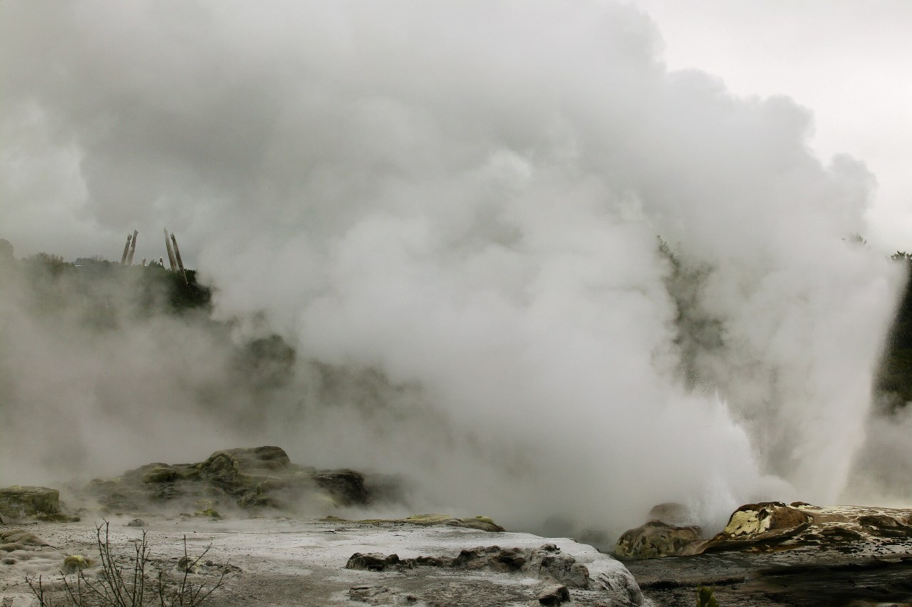 A view of some work done at the body of water, cloud, geological phenomenon, geology, geyser, highland, hill station, mist, mountain, sky, tree, water, gray