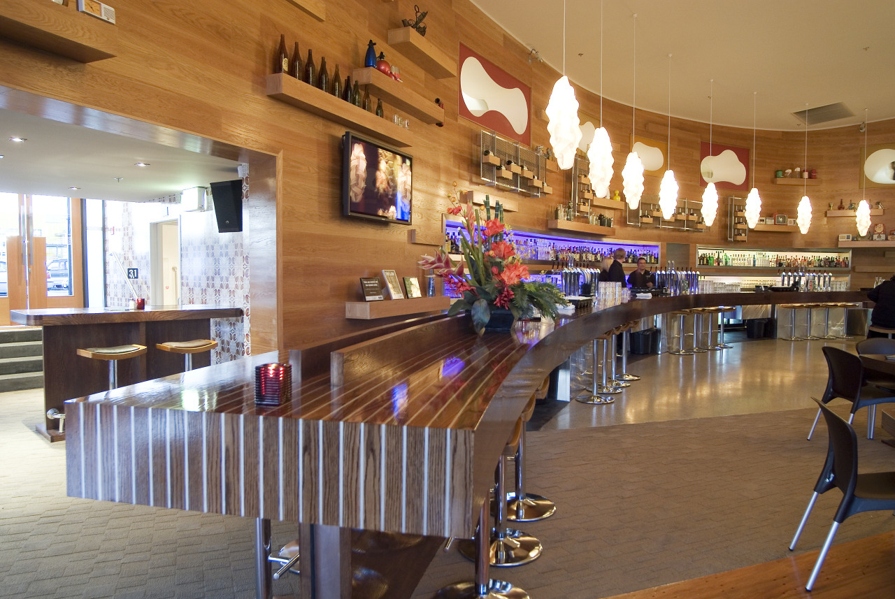 A view of a bar at Syvia Park cafeteria, function hall, interior design, lobby, restaurant, table, wood, brown