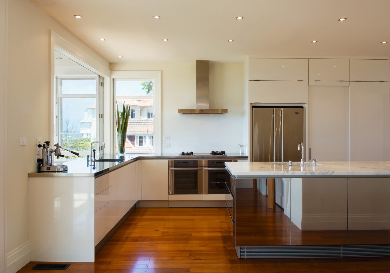 Minimal in it's aesthetic, this kitchen maximies impact cabinetry, ceiling, countertop, floor, flooring, hardwood, interior design, kitchen, property, real estate, room, wood flooring, orange, brown