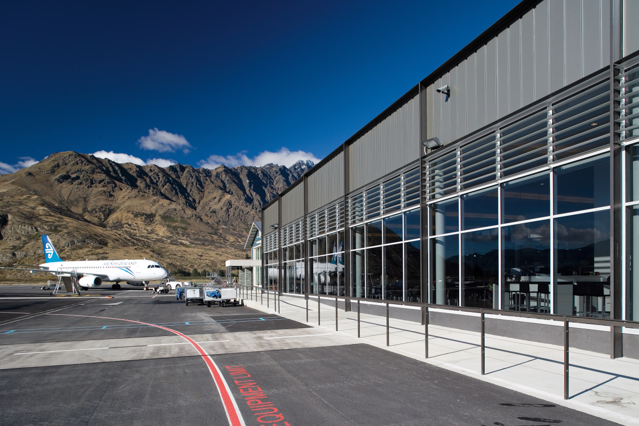 A view of the Queenstown Airport designed by architecture, building, corporate headquarters, facade, headquarters, infrastructure, sky, structure, gray, blue