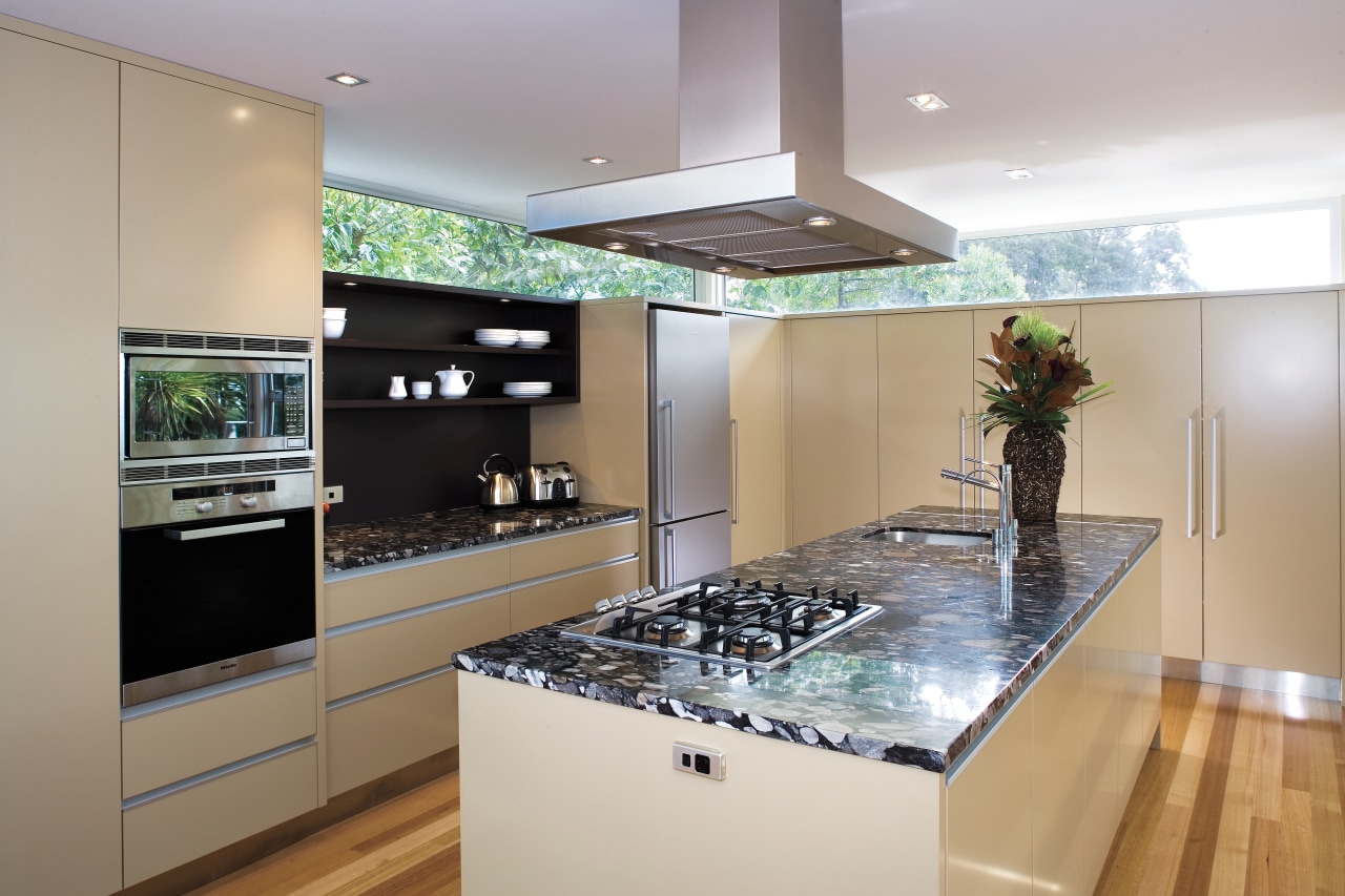 A view of this kitchen featuring polished timber countertop, interior design, kitchen, real estate, room, gray