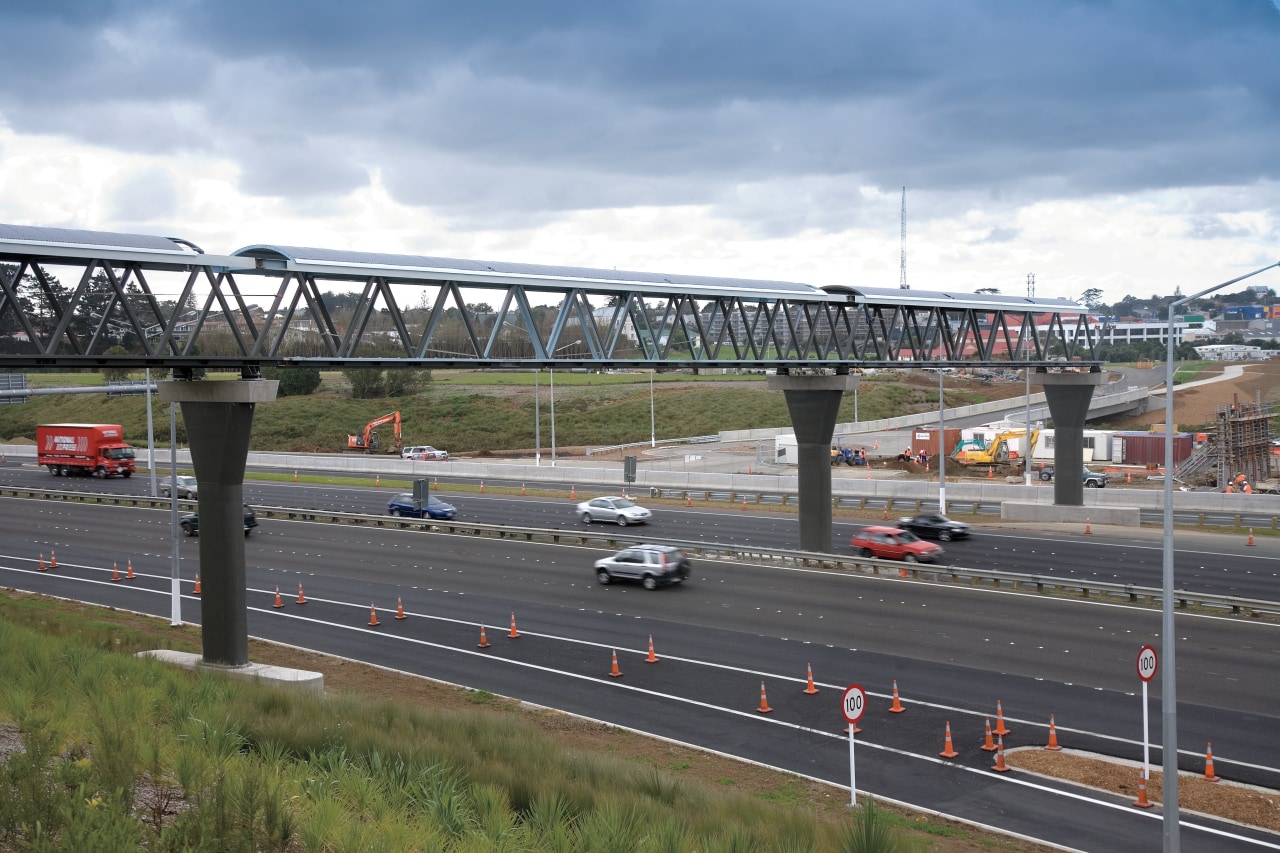 A view of some work done by Auckland bridge, car, controlled access highway, extradosed bridge, fixed link, girder bridge, highway, infrastructure, lane, metropolitan area, overpass, road, sky, skyway, transport, urban area, gray