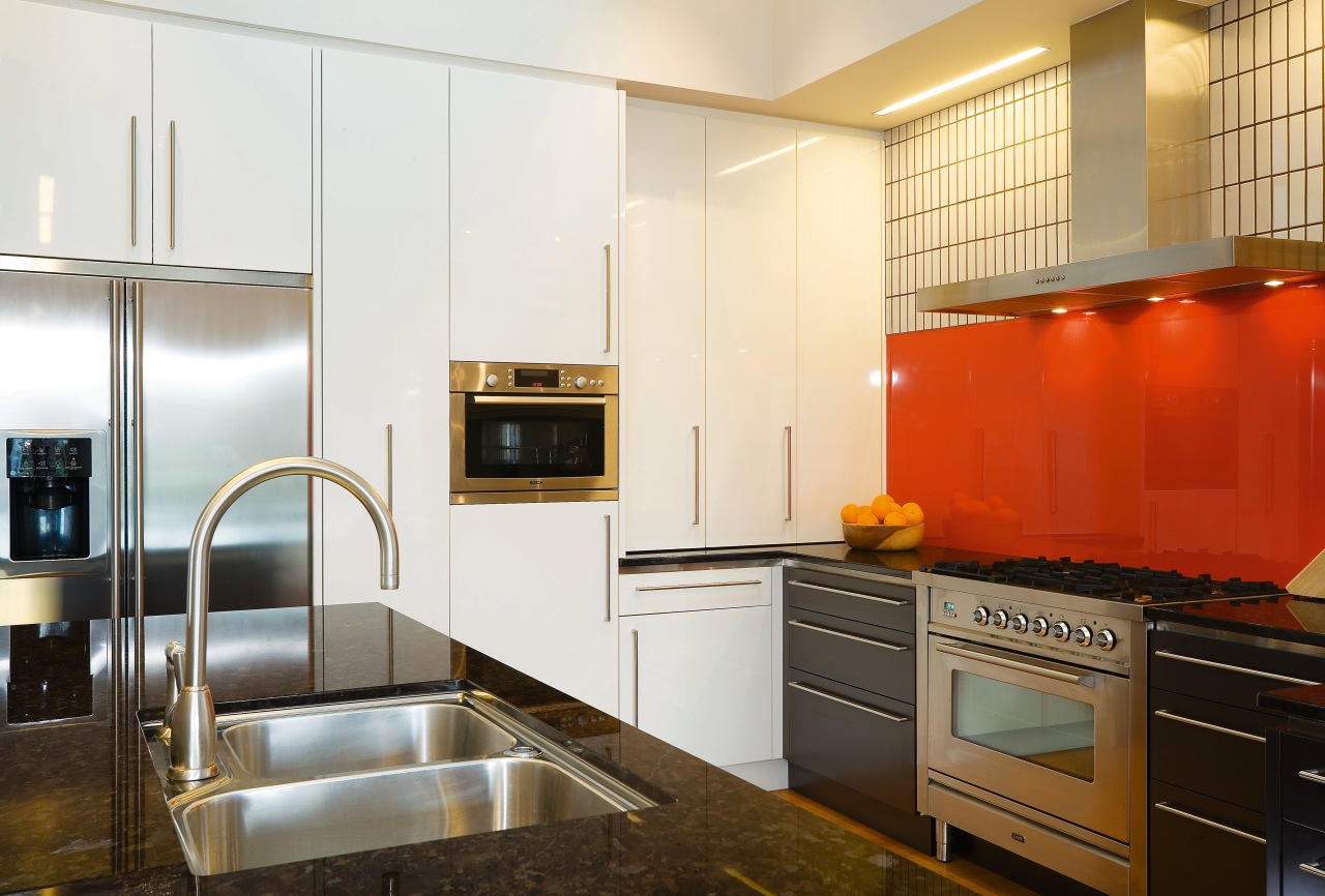 A view of this kitchen featuring kauri flooring, cabinetry, countertop, cuisine classique, home appliance, interior design, kitchen, real estate, room, white