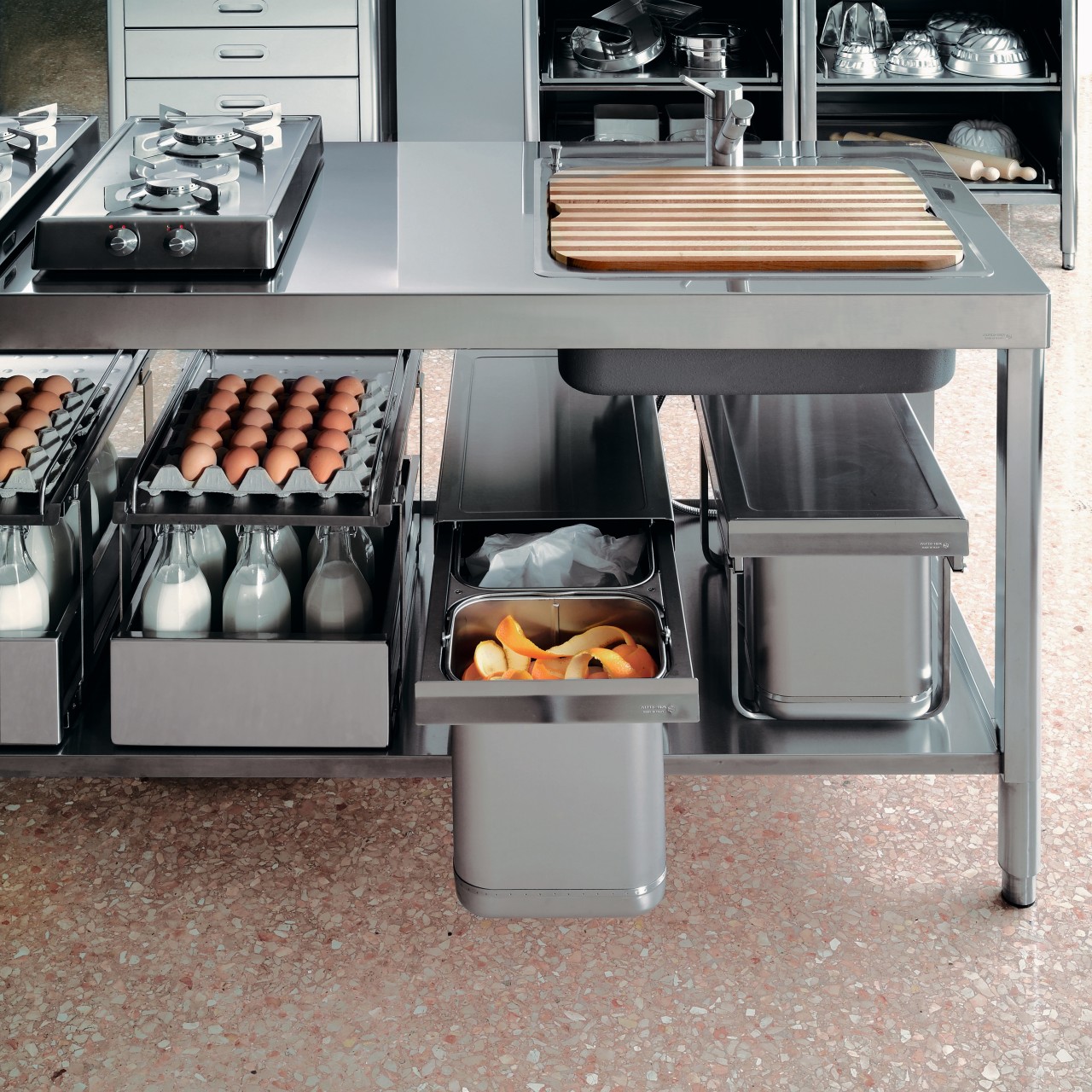 A view of this kitchen featuring stainless steel countertop, furniture, home appliance, kitchen, kitchen appliance, product design, small appliance, gray