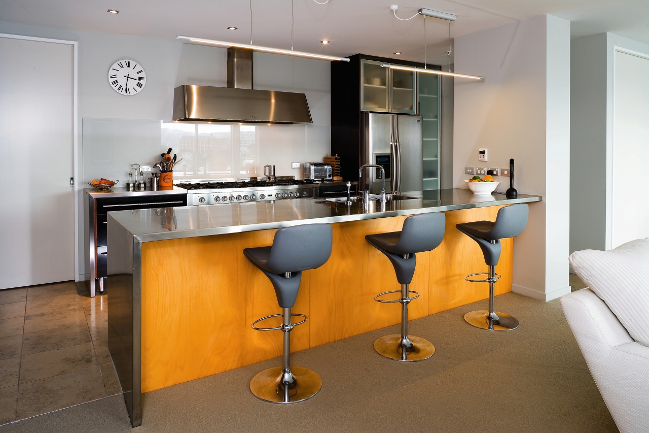 A veiw of this kitchen featuring stainless steel countertop, furniture, interior design, kitchen, product design, real estate, room, table, gray, brown