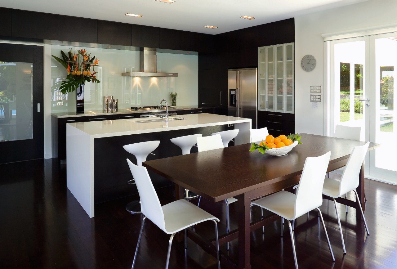 This contemporary kitchen incorporates plenty of storage, including countertop, dining room, interior design, kitchen, real estate, room, table, black, gray