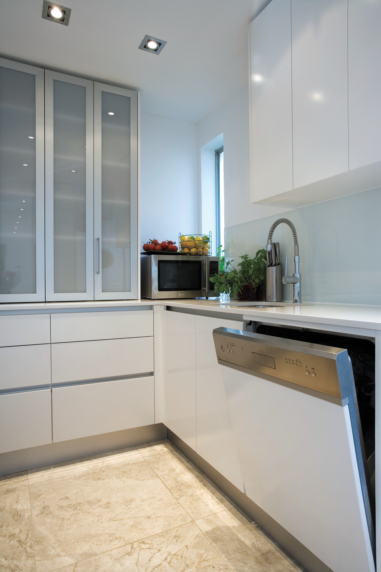 A view of this kitchen featuring the latest cabinetry, countertop, cuisine classique, home, home appliance, interior design, kitchen, room, gray