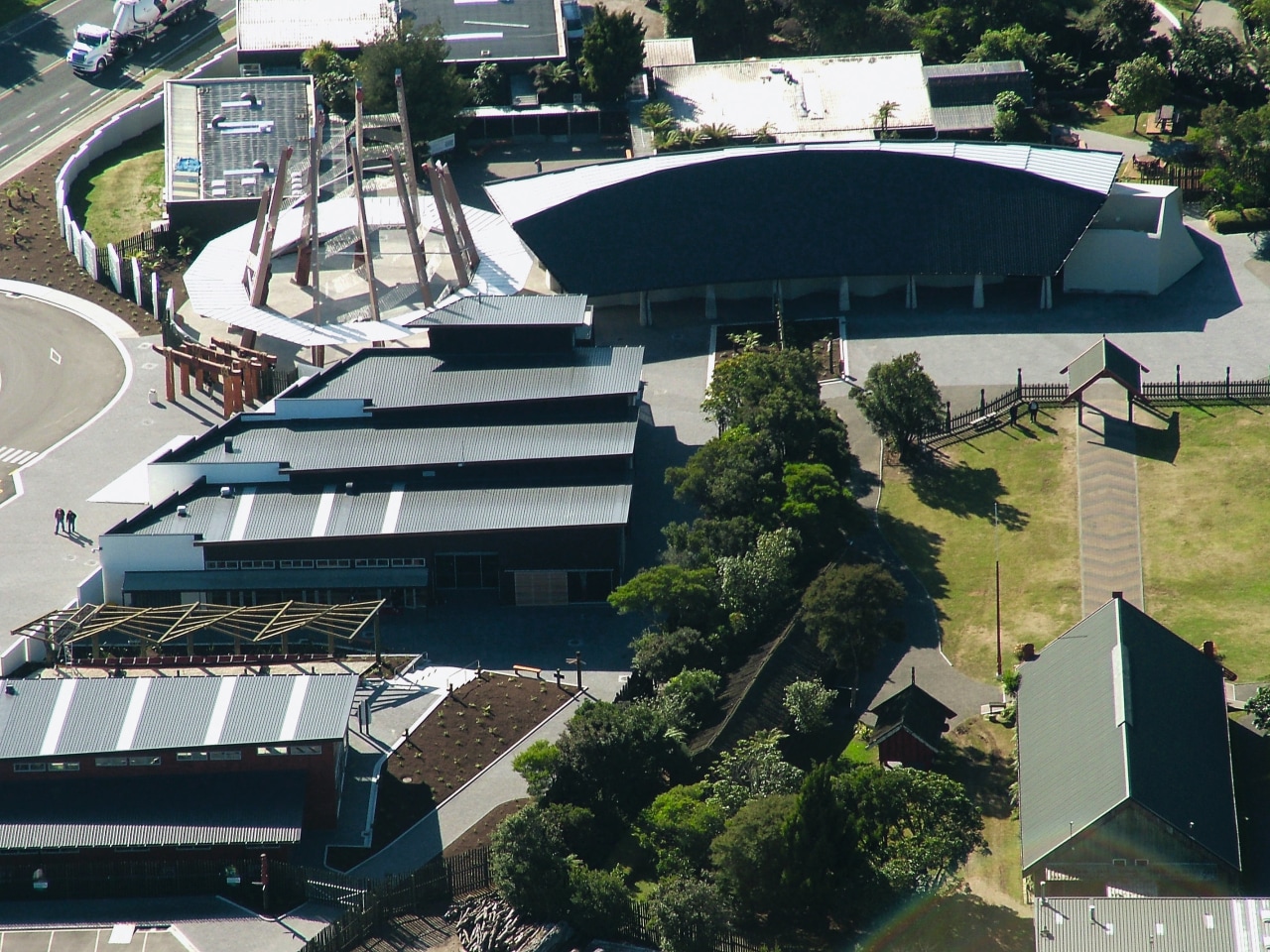 An aerial view of the roffing on the aerial photography, architecture, city, property, real estate, residential area, roof, sport venue, structure, suburb, black, gray