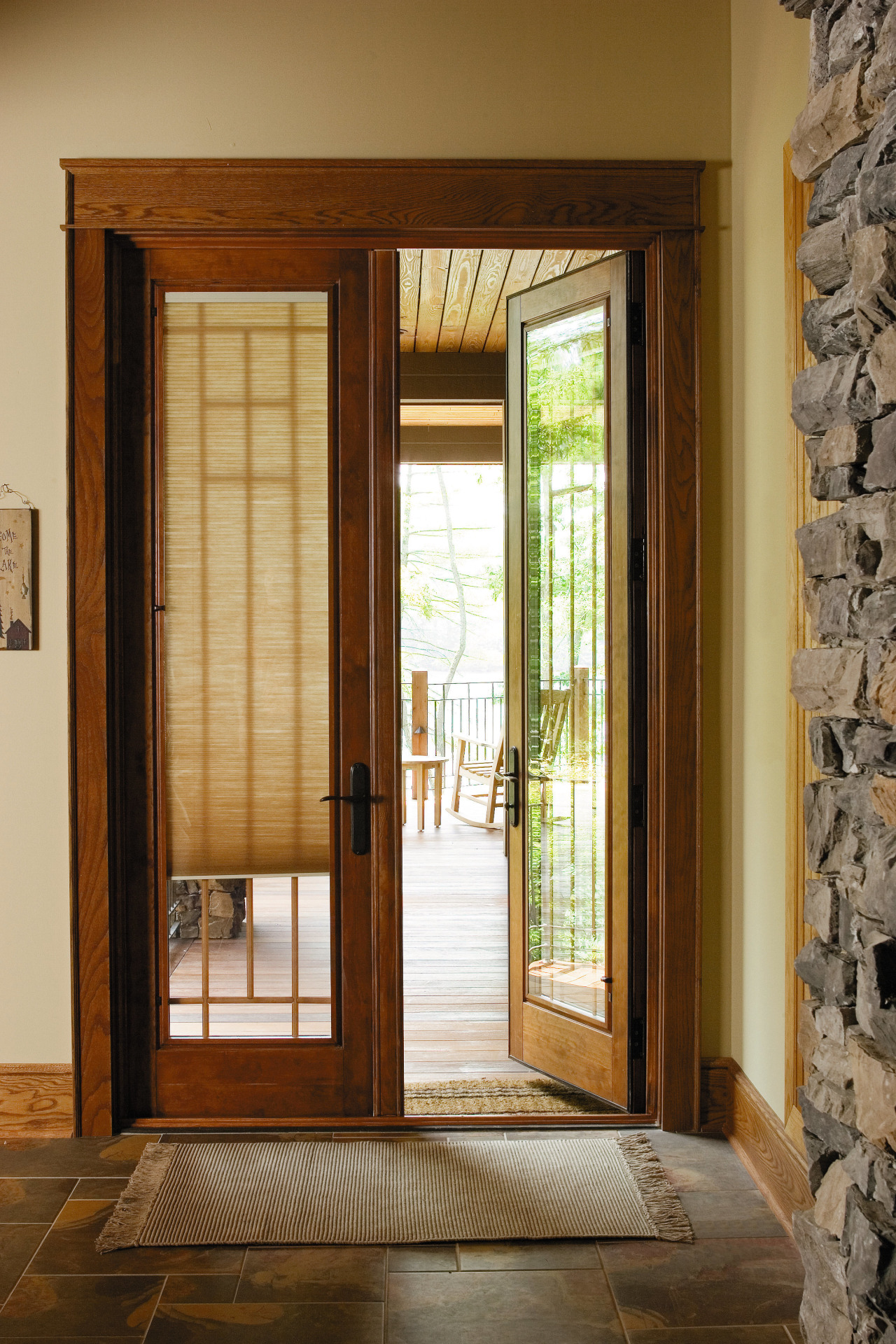 A view of this house featuring Pella timbers door, hardwood, home, interior design, real estate, window, window covering, window treatment, wood, brown
