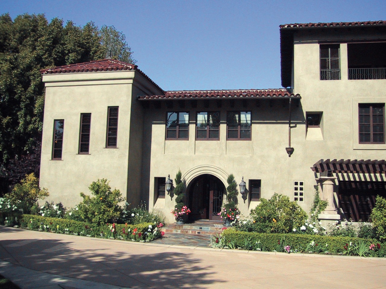 This spanish-style residence was transformed by the Landry building, estate, facade, home, house, mansion, tree, window, black