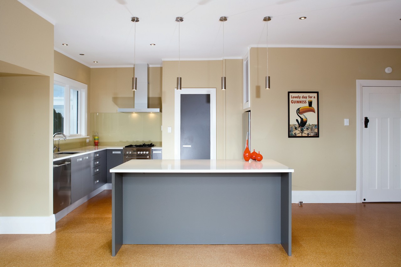 A view of this interior living space featuring cabinetry, ceiling, countertop, floor, flooring, home, interior design, kitchen, real estate, room, table, gray