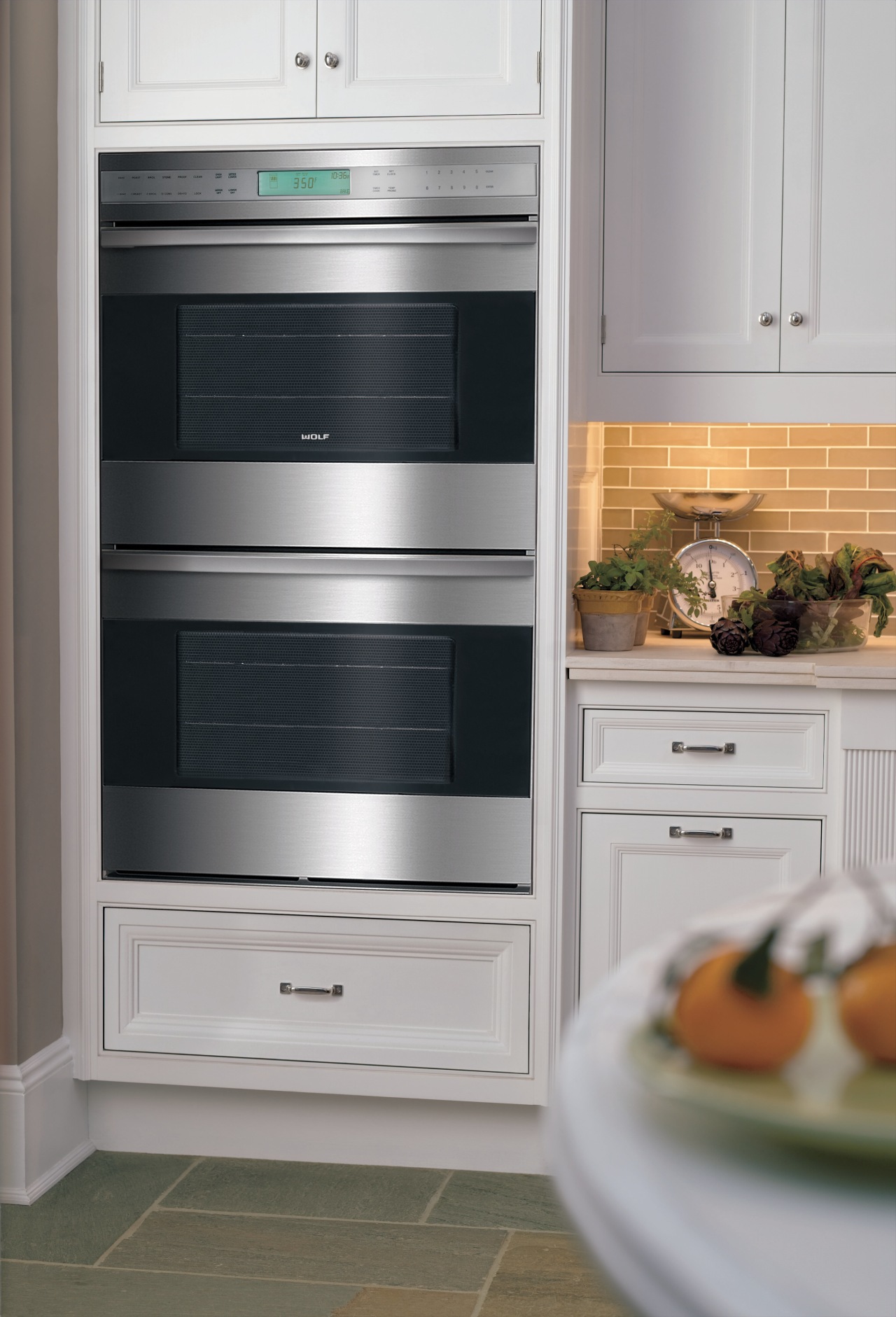 The latest E Line range is displayed in gas stove, home appliance, kitchen, kitchen appliance, kitchen stove, major appliance, microwave oven, oven, refrigerator, gray