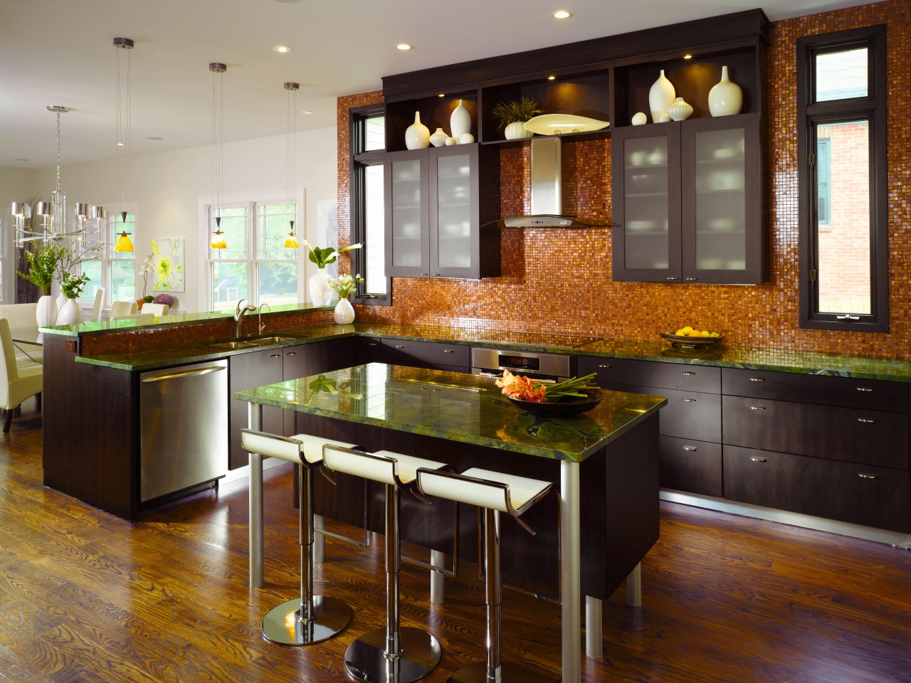 Kitchen designer Shadawn Zareh has kept the island cabinetry, countertop, cuisine classique, floor, flooring, hardwood, interior design, kitchen, room, wood flooring, brown, gray, black