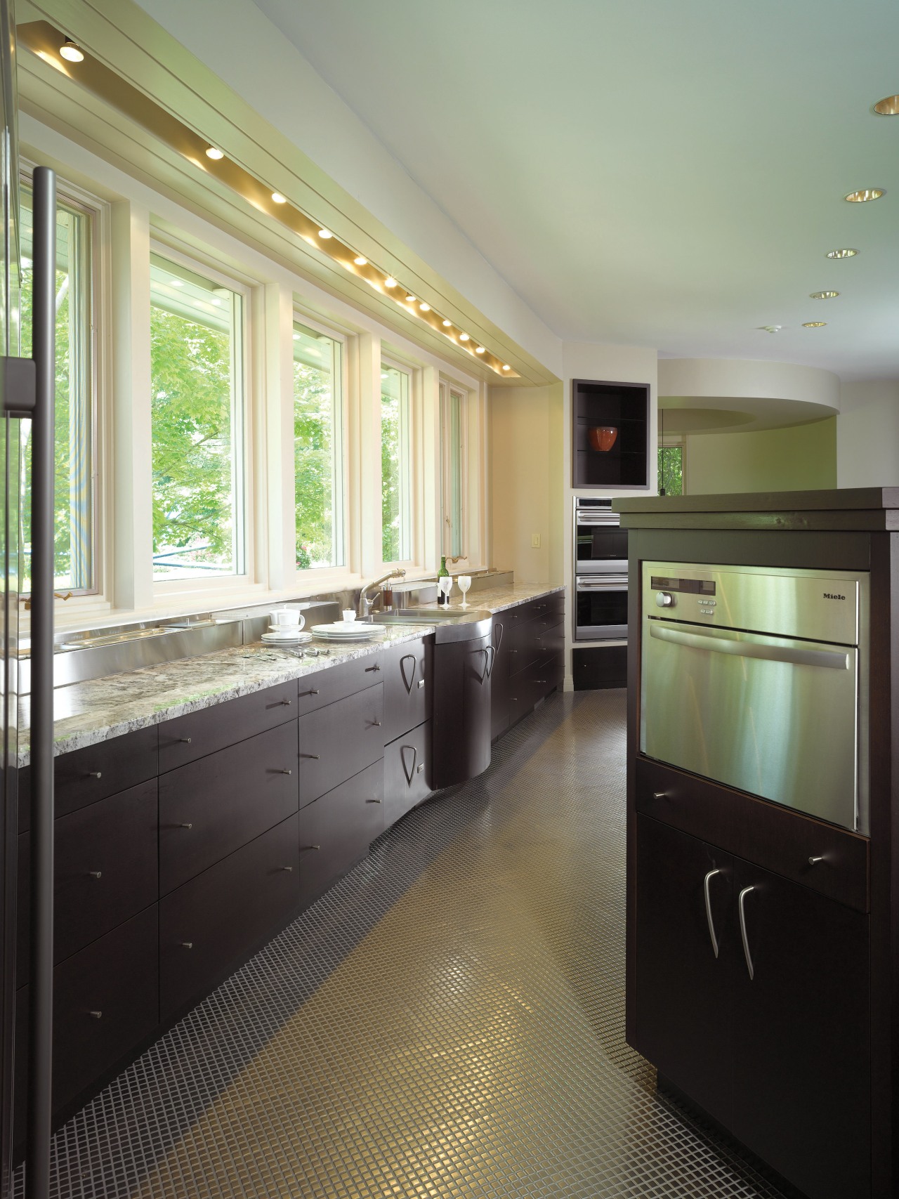 A view of the kitchen area, tiled floor, bathroom, cabinetry, ceiling, countertop, floor, flooring, home, interior design, kitchen, real estate, room, window, gray, black