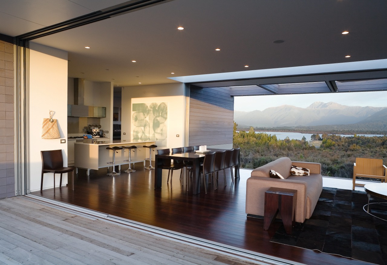 A view of the kitchen, ldining and living architecture, ceiling, daylighting, floor, flooring, house, interior design, living room, real estate, roof, table, window, black, gray