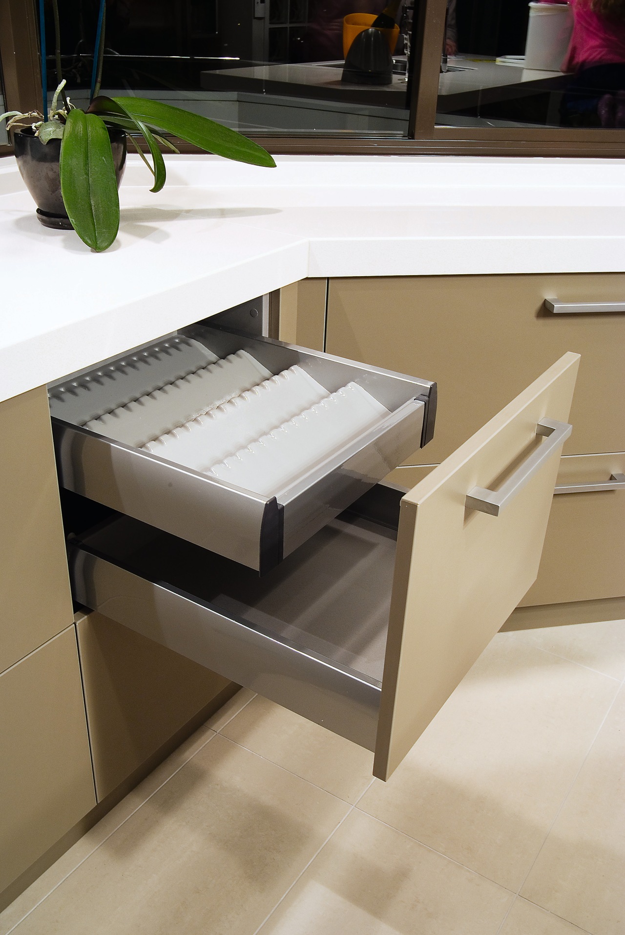 A view of this modern contemporary designed kitchens coffee table, drawer, furniture, product, product design, table, gray, brown