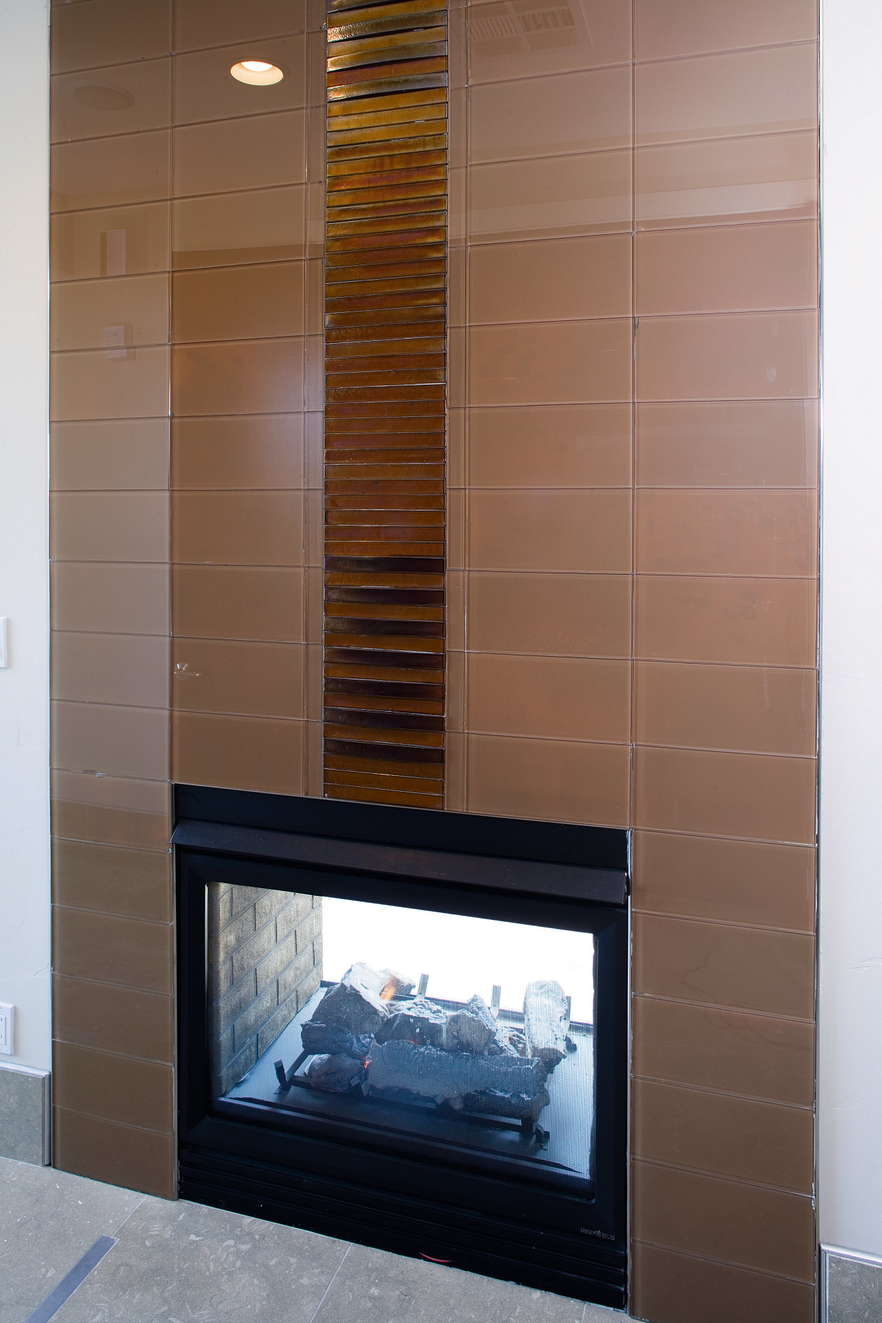 Glaas tiles were laid horizontally to create an fireplace, flooring, hearth, interior design, brown