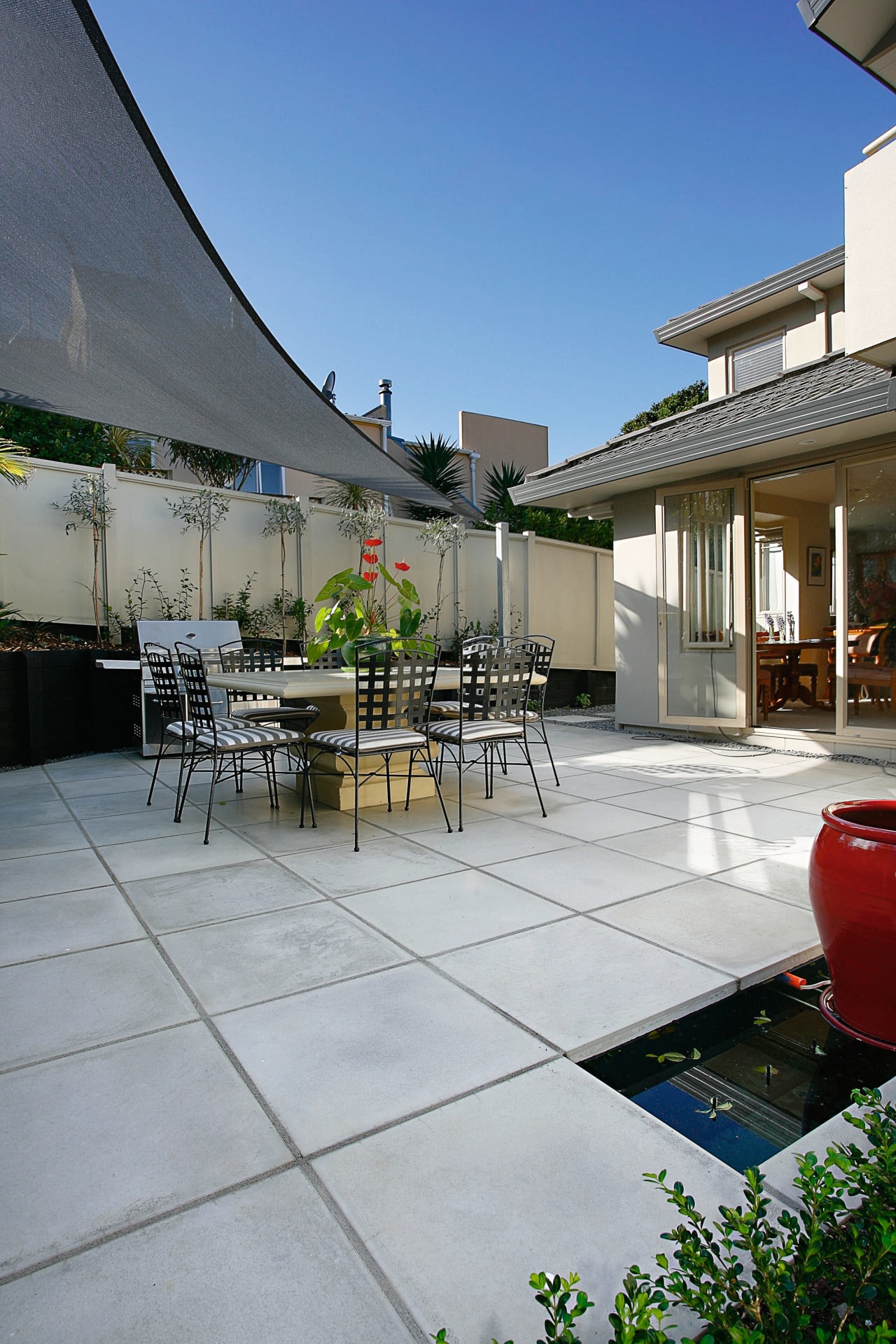 A view of the jagas platinum pavers layed apartment, architecture, backyard, courtyard, estate, house, outdoor structure, patio, real estate, residential area, roof, gray