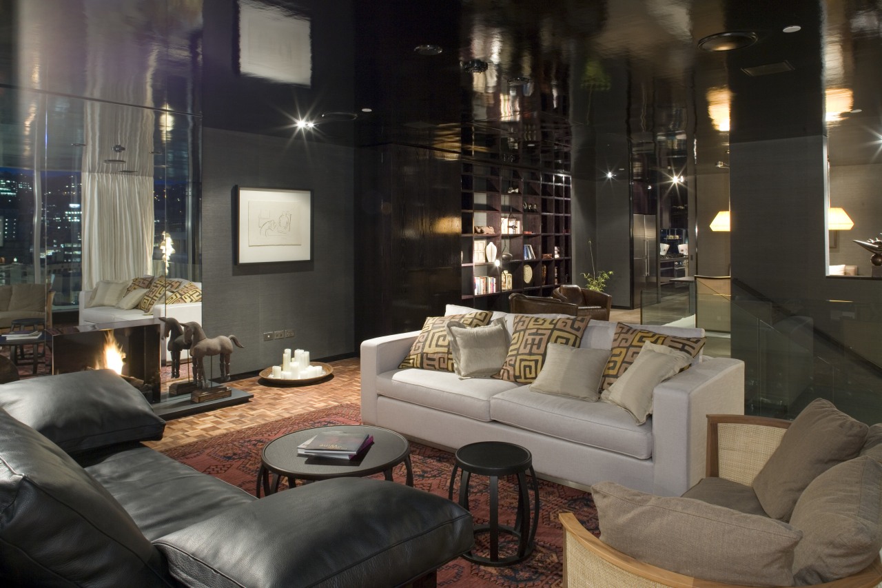 An interior view of this apartment living area home, interior design, lighting, living room, lobby, property, room, black