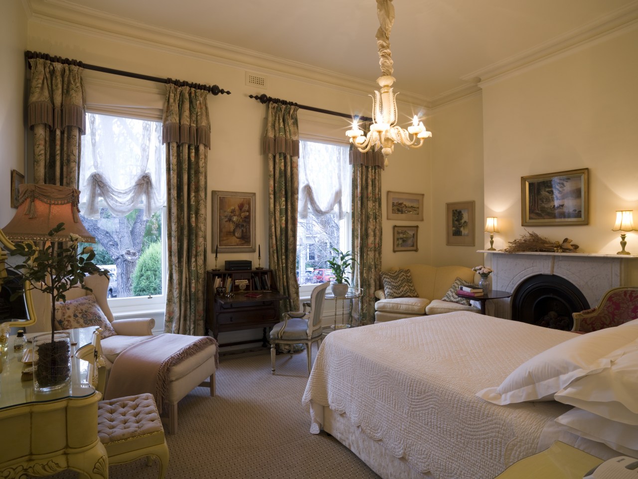 The writing bureau in the bedroom is emblematic bed, bedroom, ceiling, estate, furniture, home, interior design, living room, property, real estate, room, suite, window, window treatment, brown