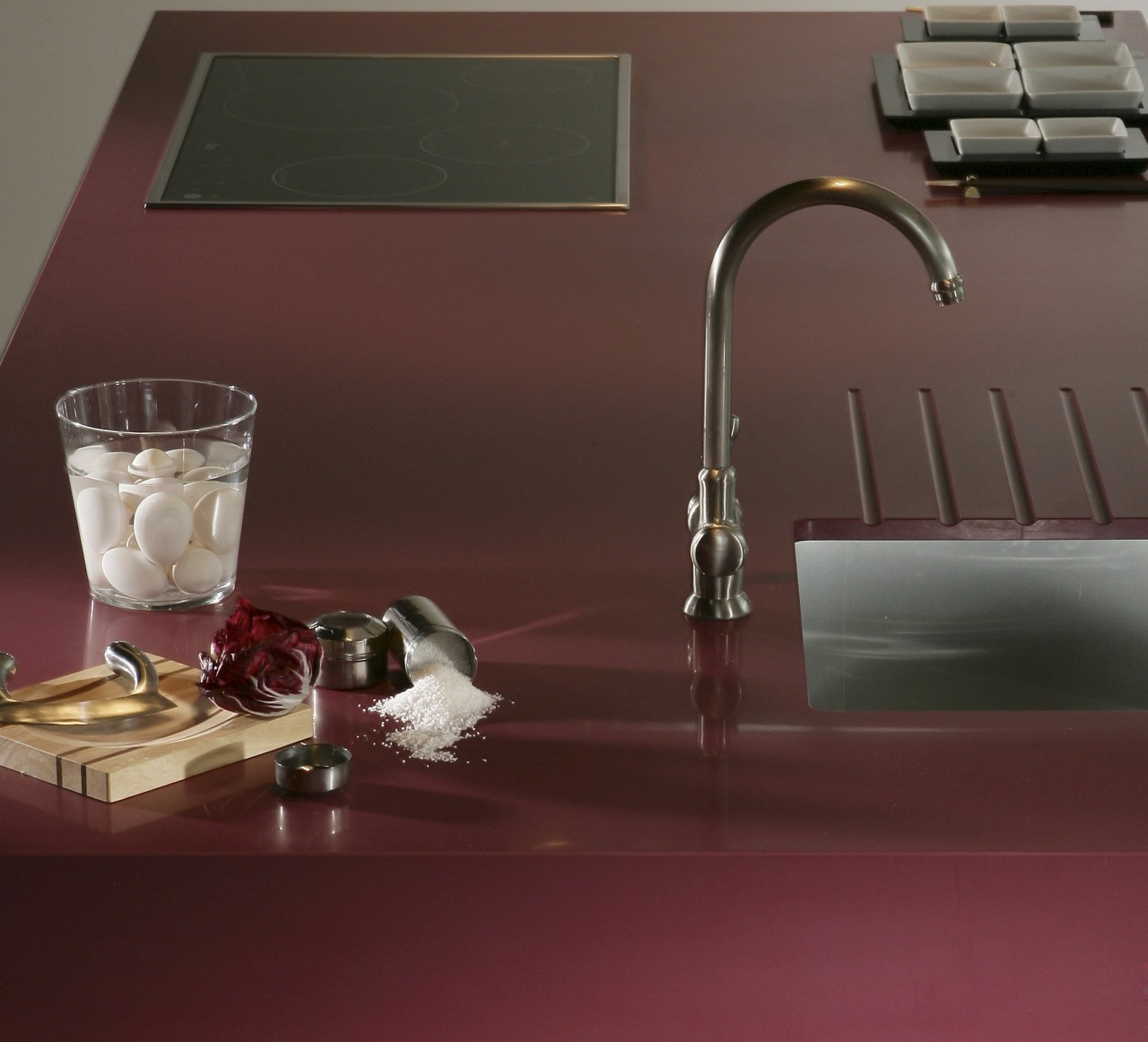 Other silestone surfaces include, Koan and Gedastu from floor, flooring, plumbing fixture, product design, sink, still life photography, table, tap, red