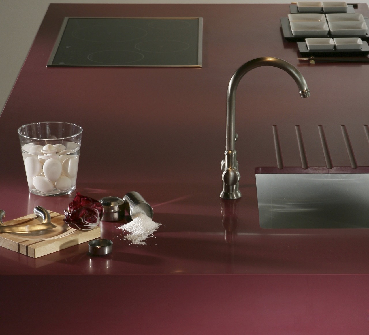 Other silestone surfaces include, Koan and Gedastu from floor, flooring, plumbing fixture, product design, sink, still life photography, table, tap, red