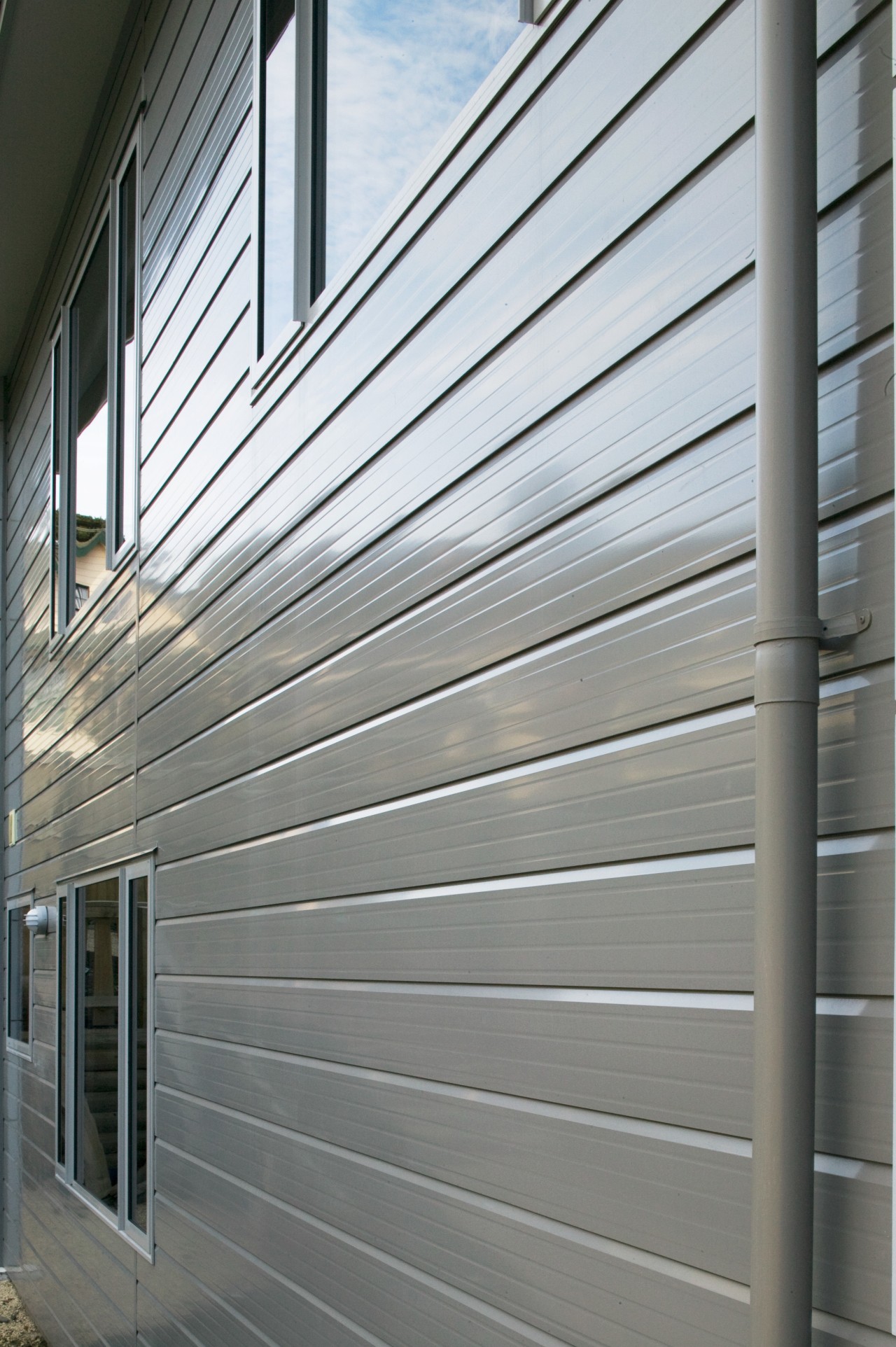 A view of some cladding from Ullrich Aluminium. daylighting, facade, house, line, siding, structure, wall, window, gray, white