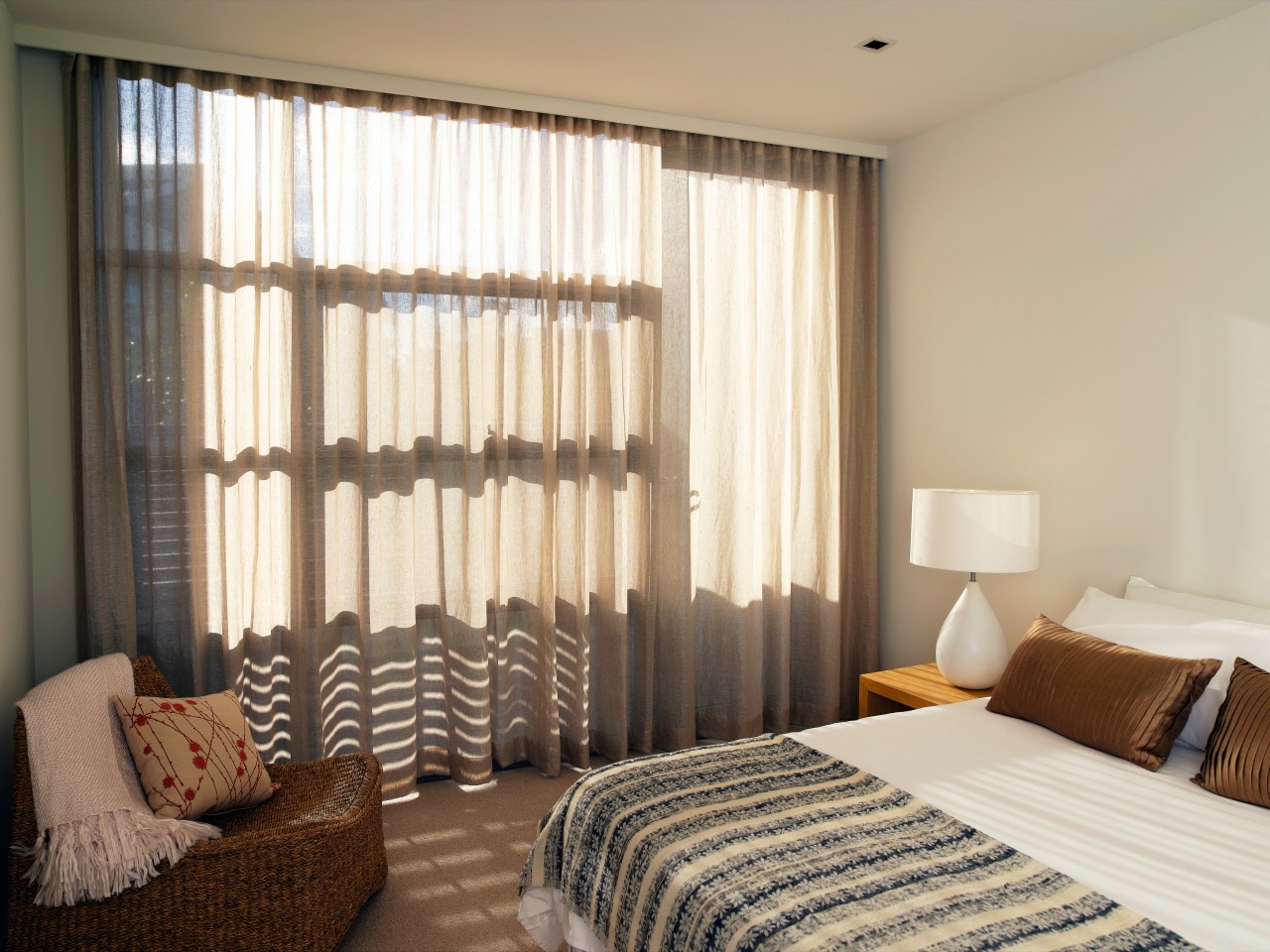 A view of the interior of this Magenta bed frame, bedroom, ceiling, curtain, decor, home, interior design, real estate, room, suite, textile, wall, window, window blind, window covering, window treatment, wood, white