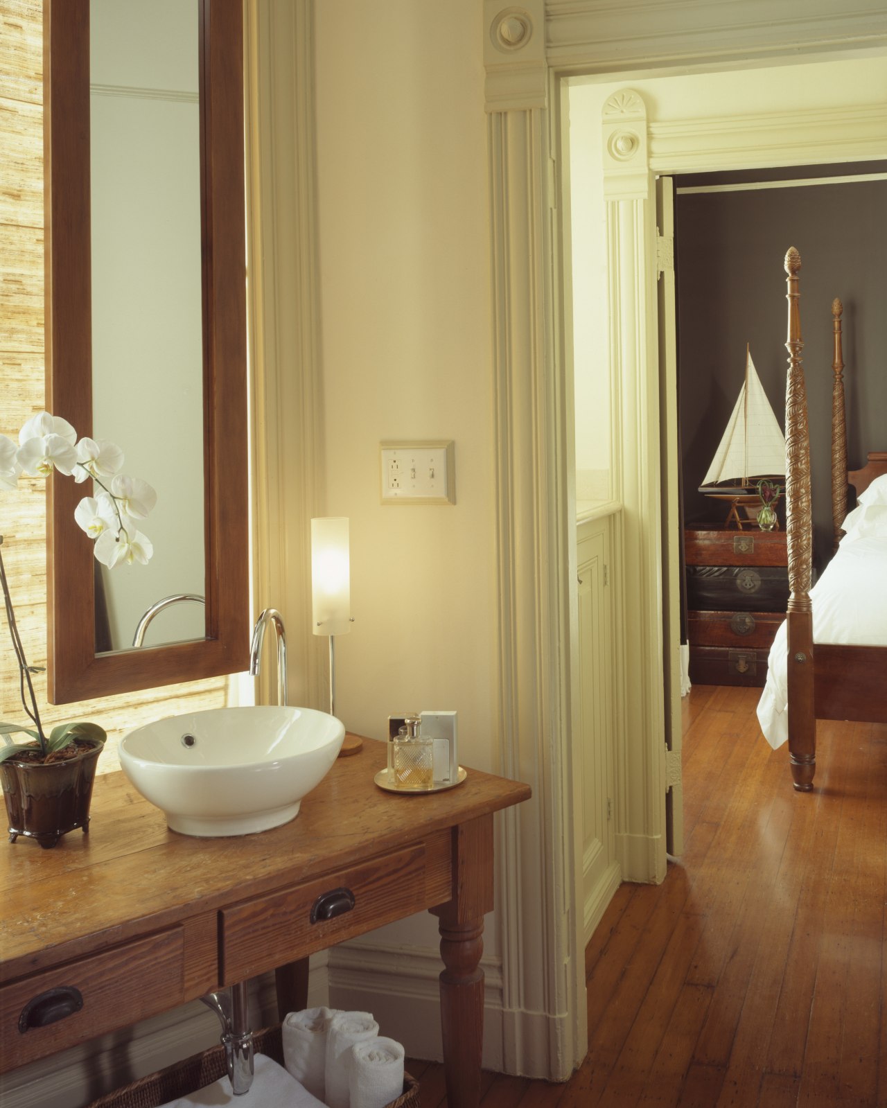 A view of this bathroom featuring polished timber bathroom, floor, flooring, hardwood, home, interior design, laminate flooring, real estate, room, sink, suite, wall, window, wood, wood flooring, brown