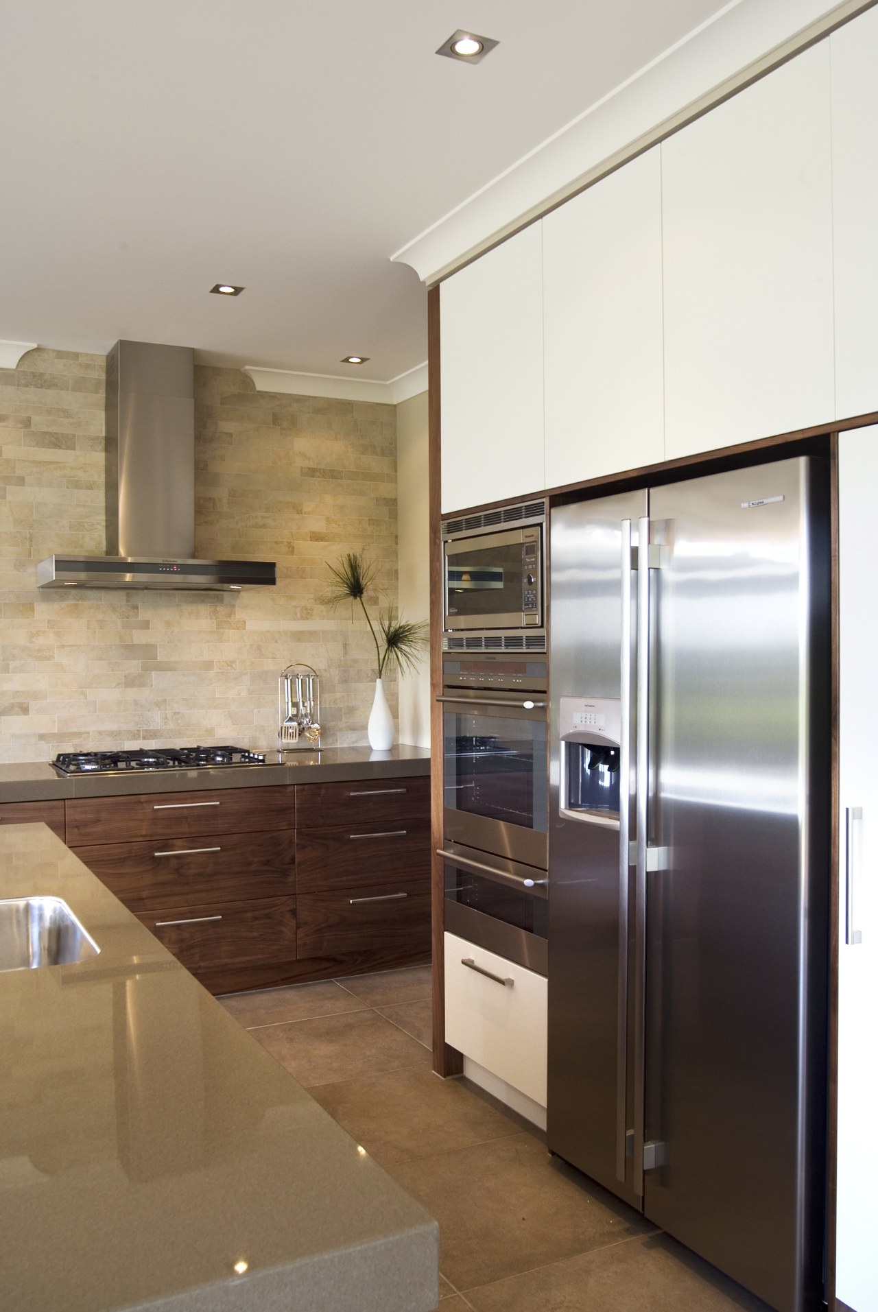 A view of some kitchen appliances from Electorlux. cabinetry, countertop, cuisine classique, home appliance, interior design, kitchen, major appliance, real estate, refrigerator, room, brown, gray