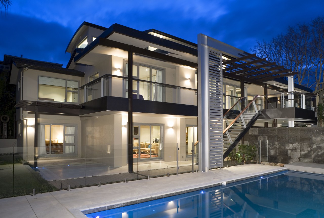 A view of a home by Santa Barbara apartment, architecture, building, elevation, estate, facade, family car, home, house, mixed use, property, real estate, residential area, swimming pool, villa, window, blue, gray