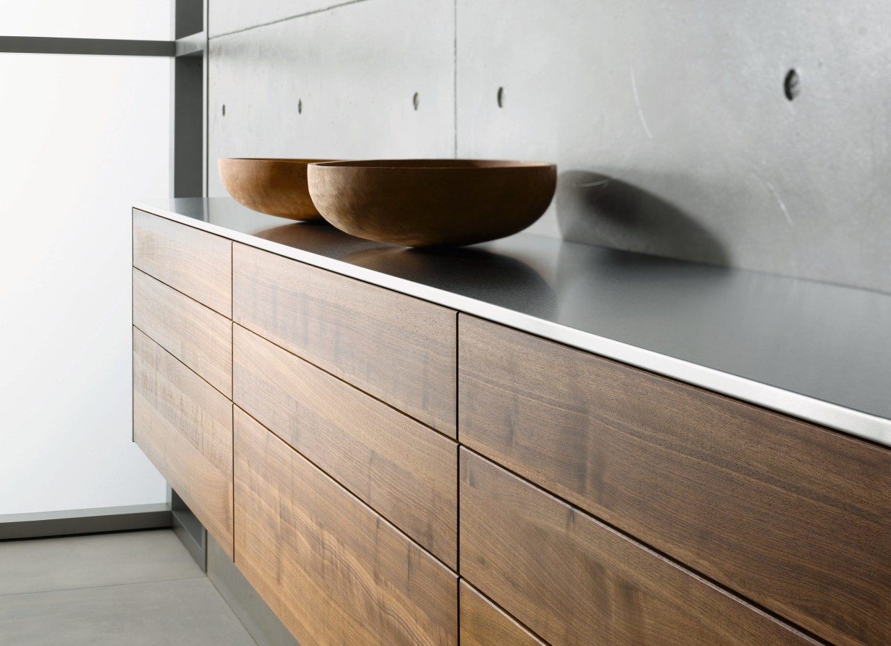 A view of this kitchen featuring Sleek contemporary chest of drawers, drawer, floor, furniture, interior design, plywood, product design, sideboard, wall, wood, wood stain, white