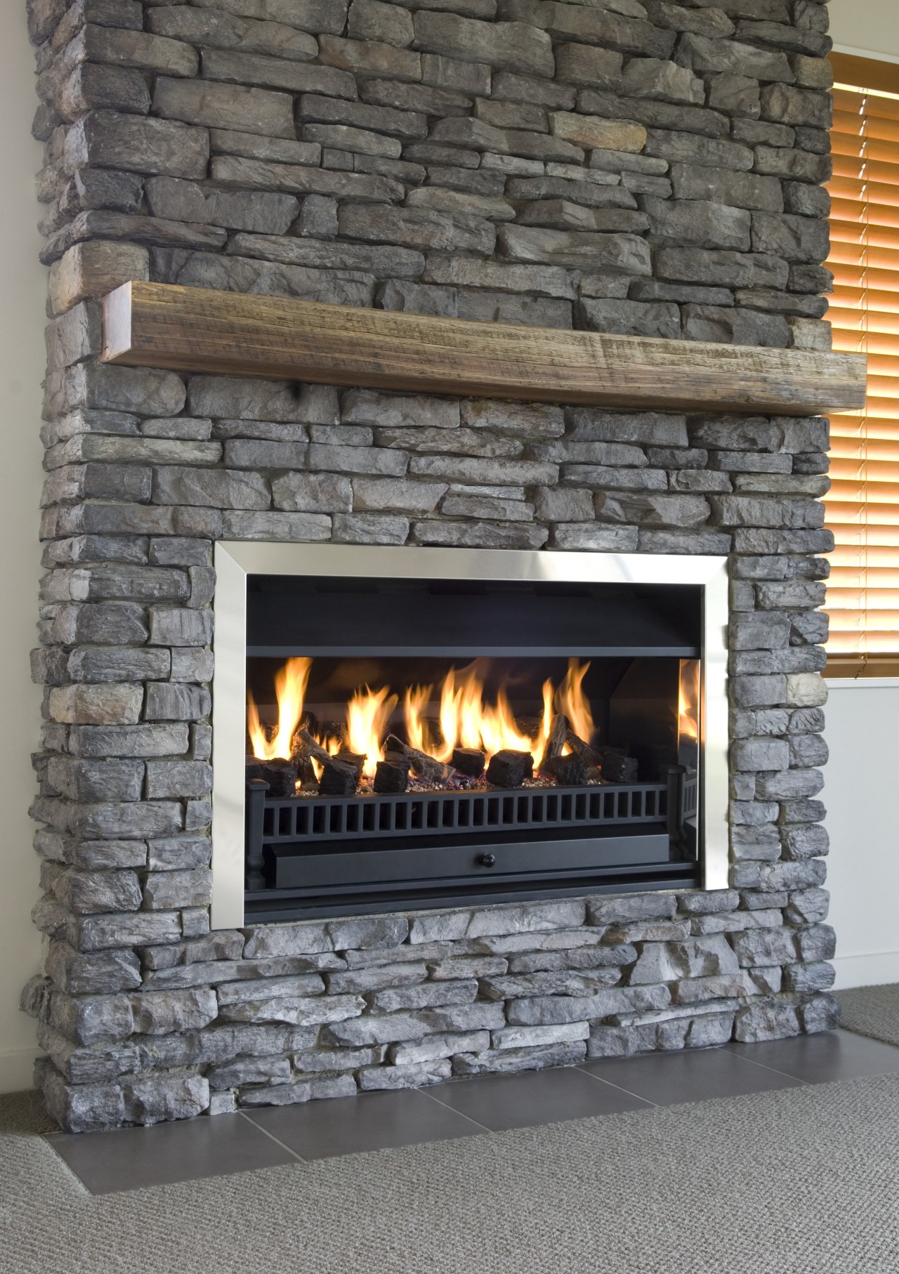 A view of a stone fireplace from Stutex fireplace, hearth, heat, masonry oven, wood burning stove, gray, black