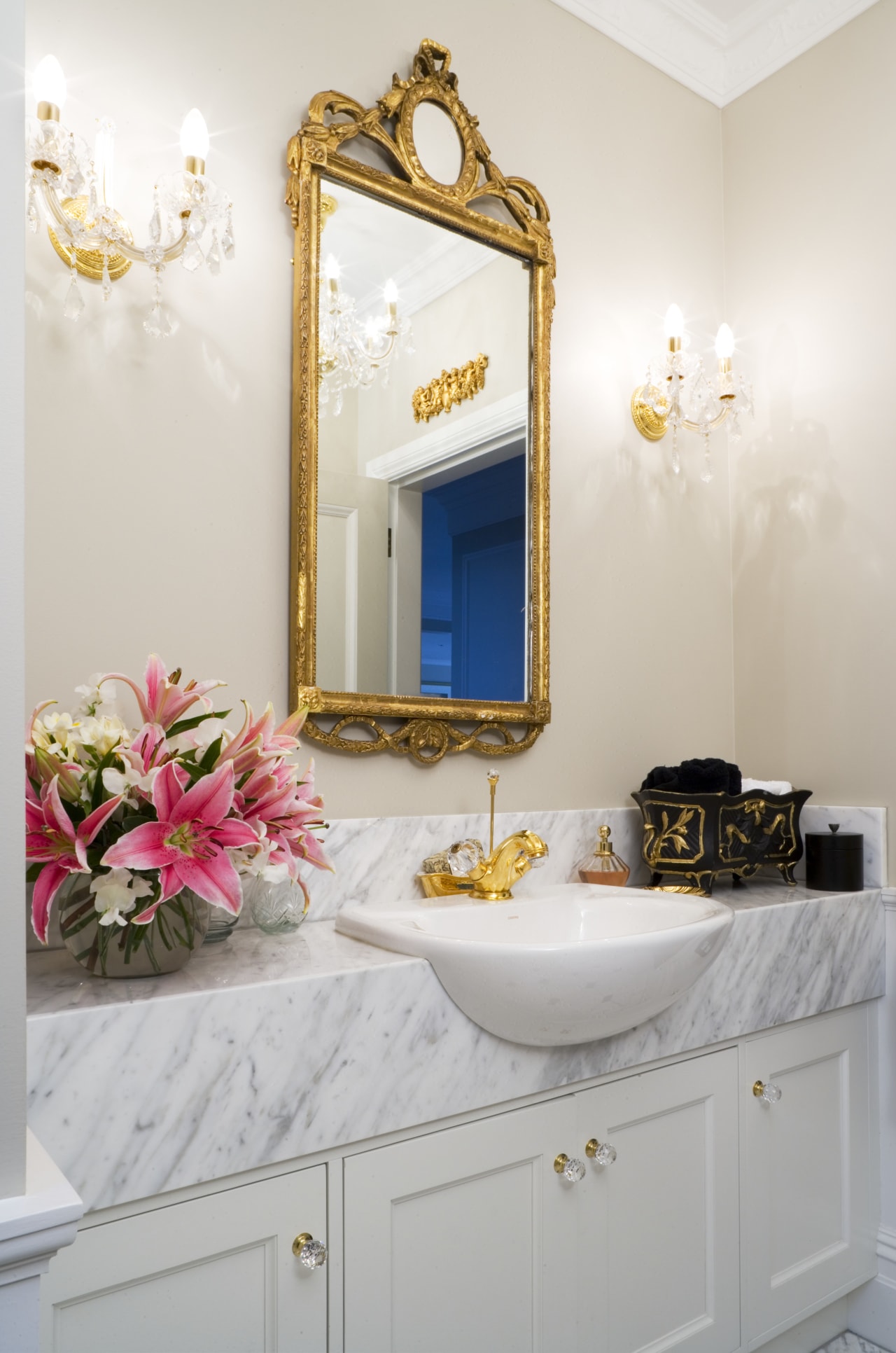 In this formal powder room, the floral theme bathroom, home, interior design, room, sink, wall, white, gray