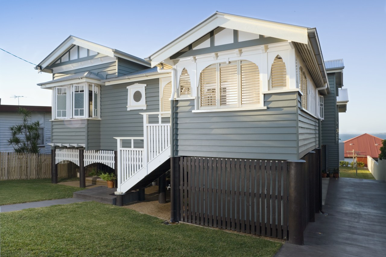 An exterior view of the entrance way to building, cottage, elevation, facade, home, house, property, real estate, residential area, siding