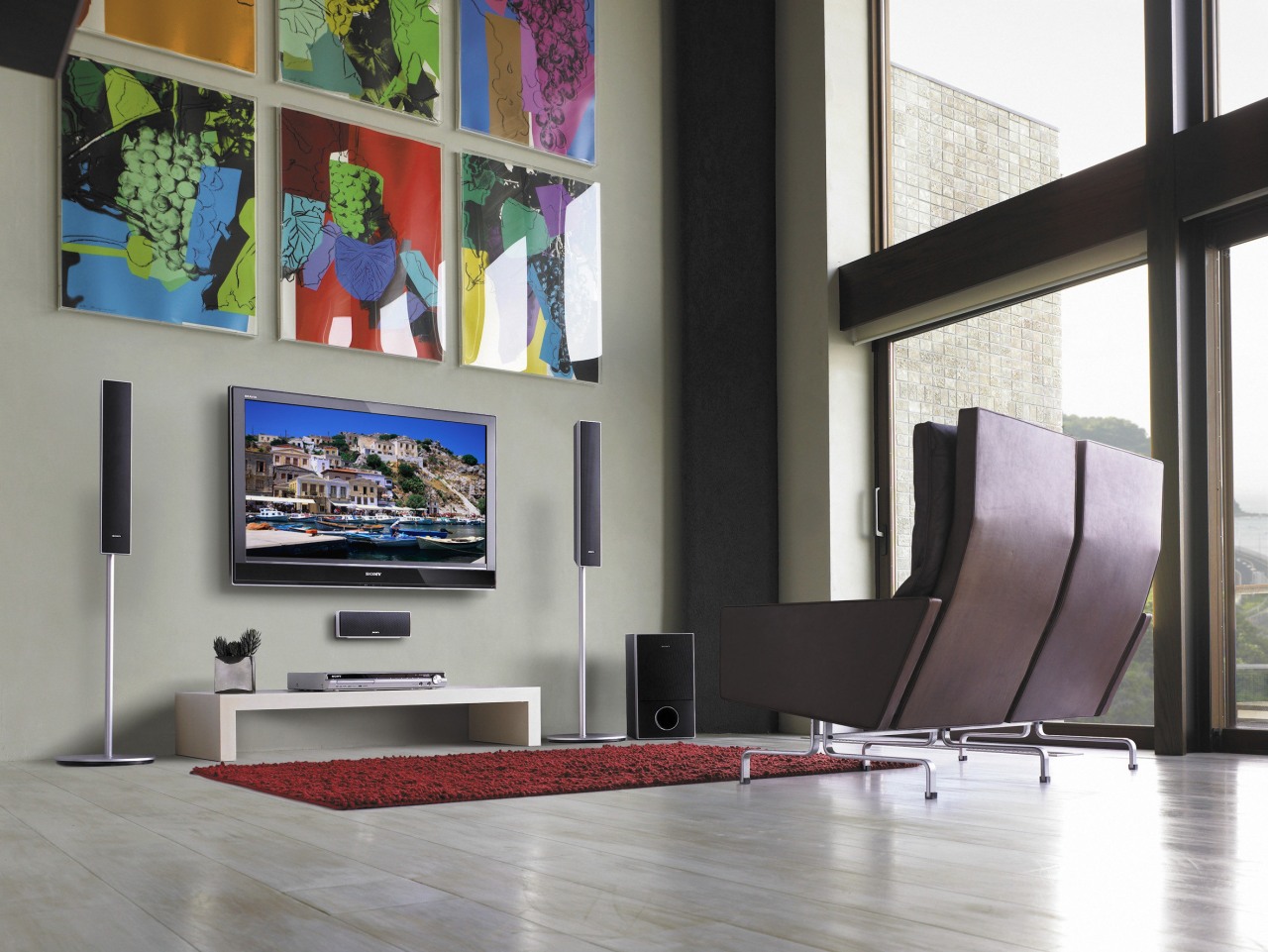 An interior view of these living areas featuring furniture, interior design, living room, table, gray