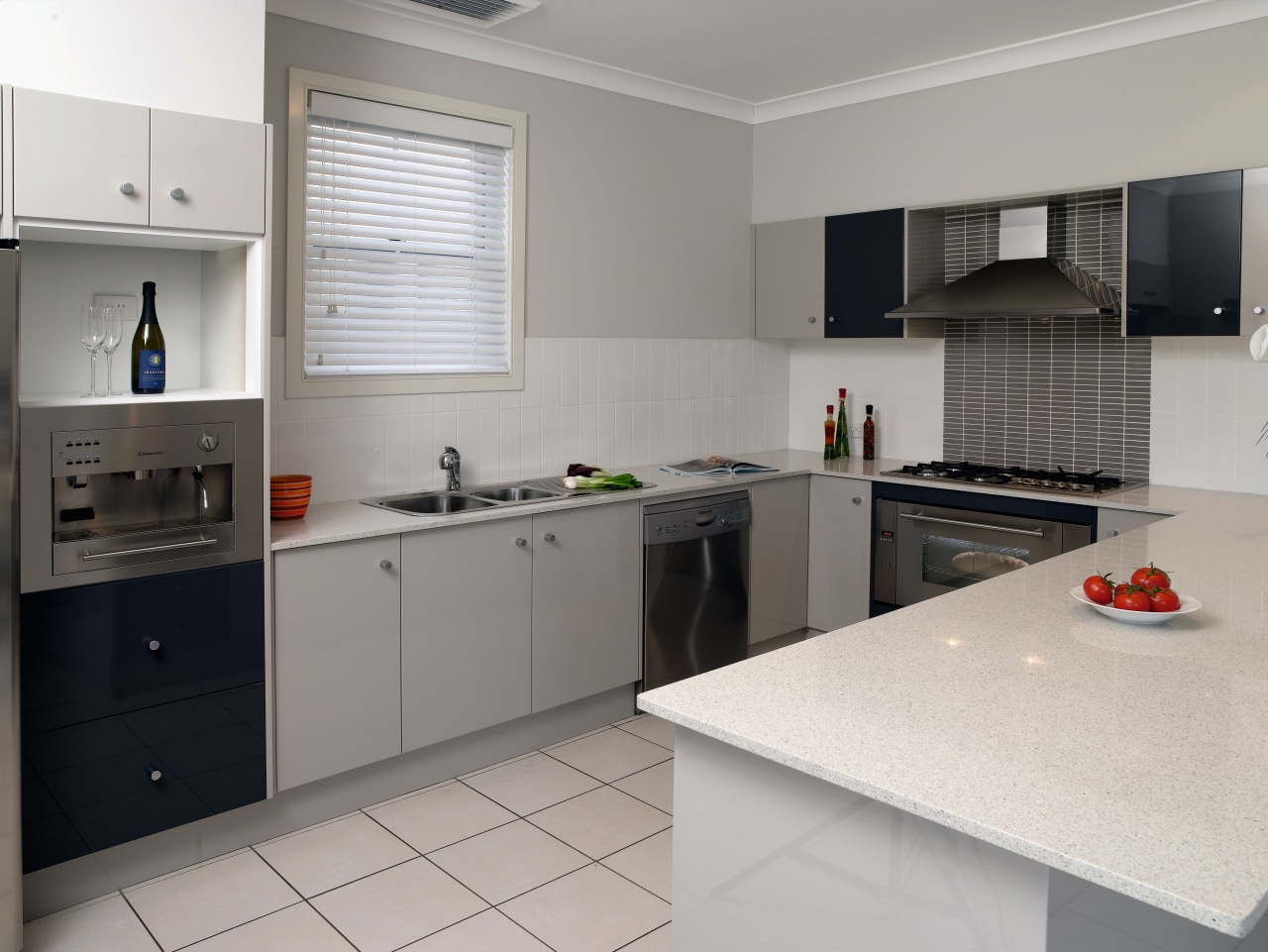 Kitchens in the Tullimbar Village development are as cabinetry, countertop, interior design, kitchen, real estate, room, gray