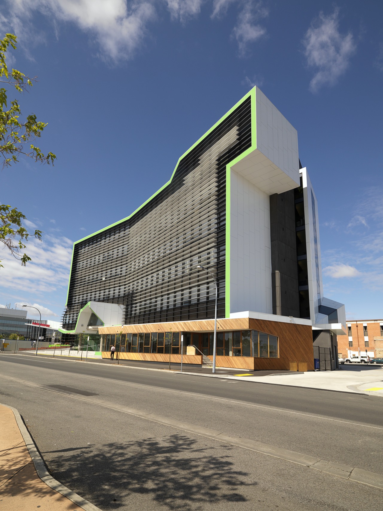 An exterior view of the new 5 Star architecture, building, commercial building, corporate headquarters, daytime, elevation, facade, headquarters, mixed use, sky, gray, blue