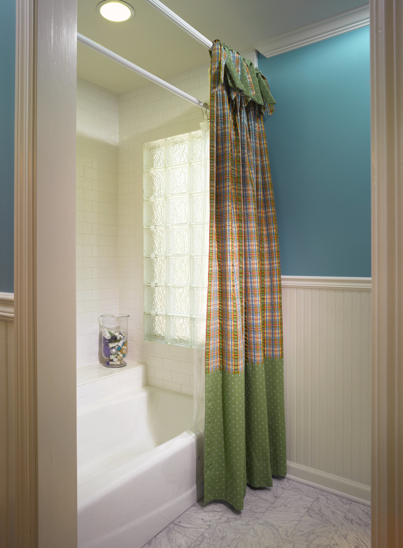 A view of this childrens bathrom designed by bathroom, curtain, floor, home, interior design, room, textile, window, window covering, window treatment, gray