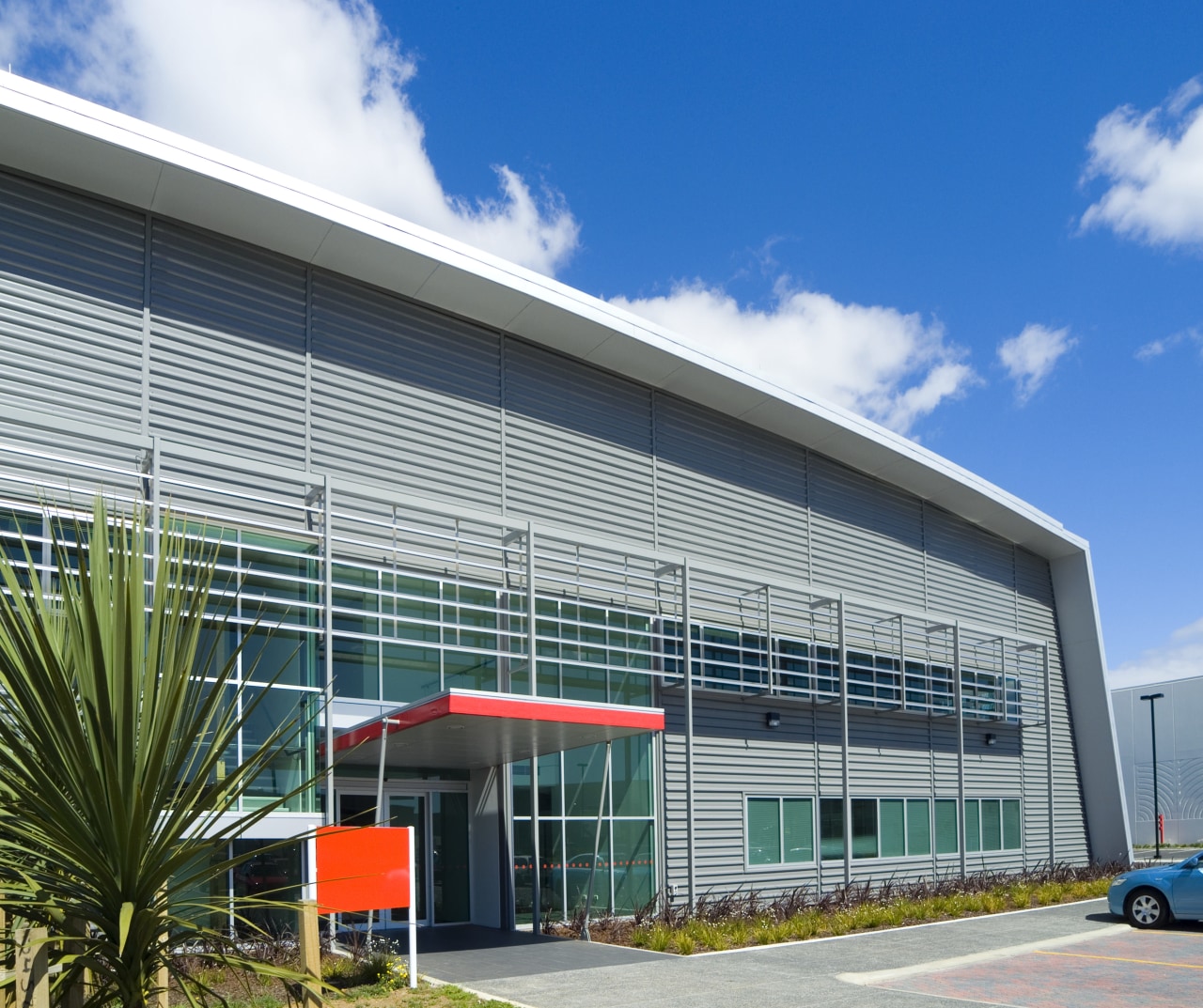 Steel Roofing was contracted to supply and install architecture, building, commercial building, corporate headquarters, facade, headquarters, real estate, sky, gray