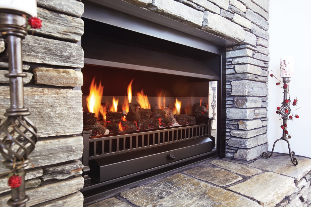 A view of a fireplace from Real Fires. fire screen, fireplace, hearth, heat, wood burning stove, gray, black