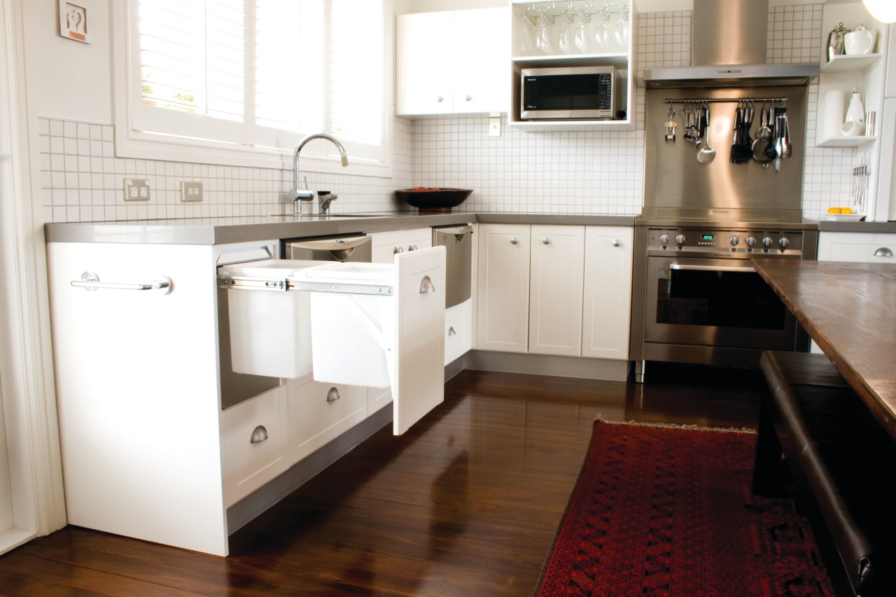 View of hideaway bin. cabinetry, countertop, cuisine classique, floor, flooring, hardwood, home appliance, interior design, kitchen, kitchen appliance, kitchen stove, laminate flooring, room, wood flooring, white