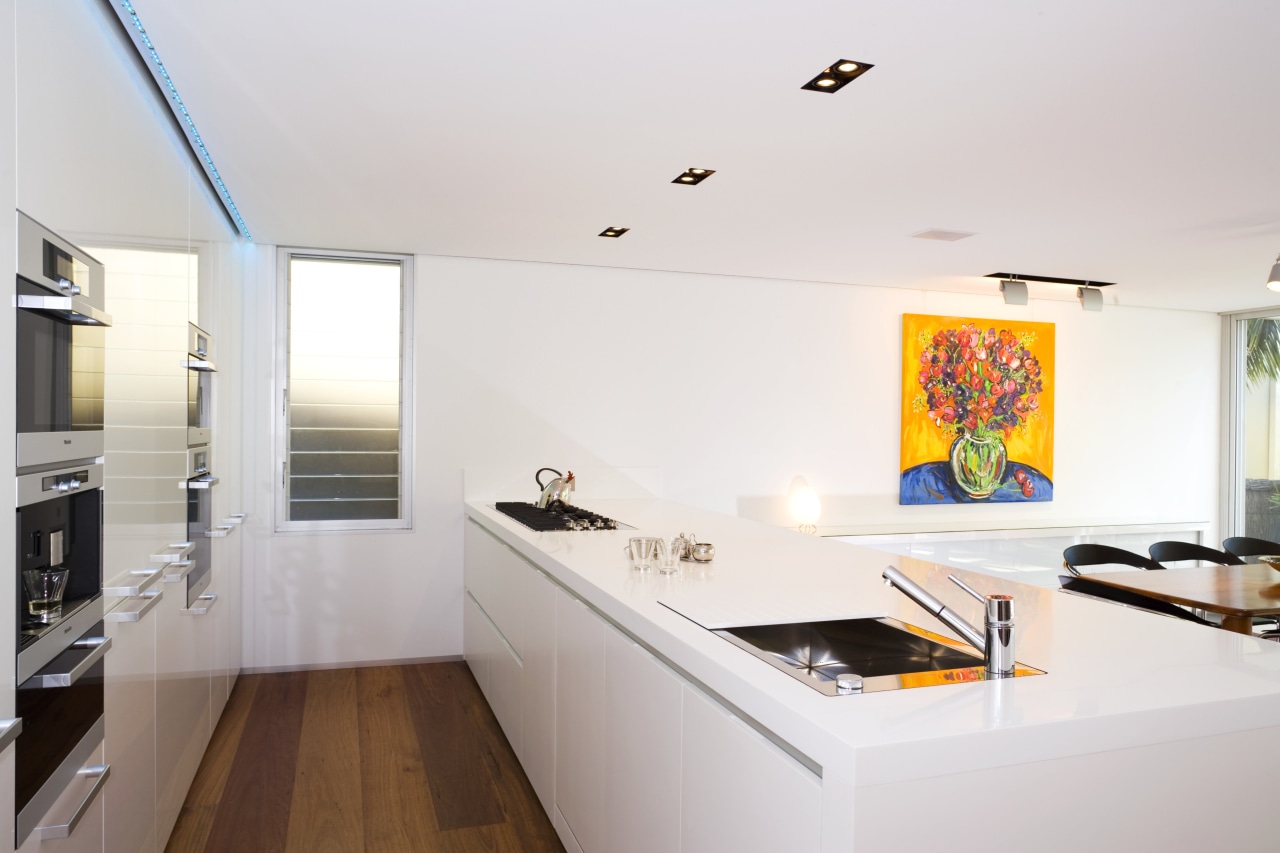 View of kitchen design by Linda Haefeli, and apartment, architecture, house, interior design, kitchen, real estate, room, white