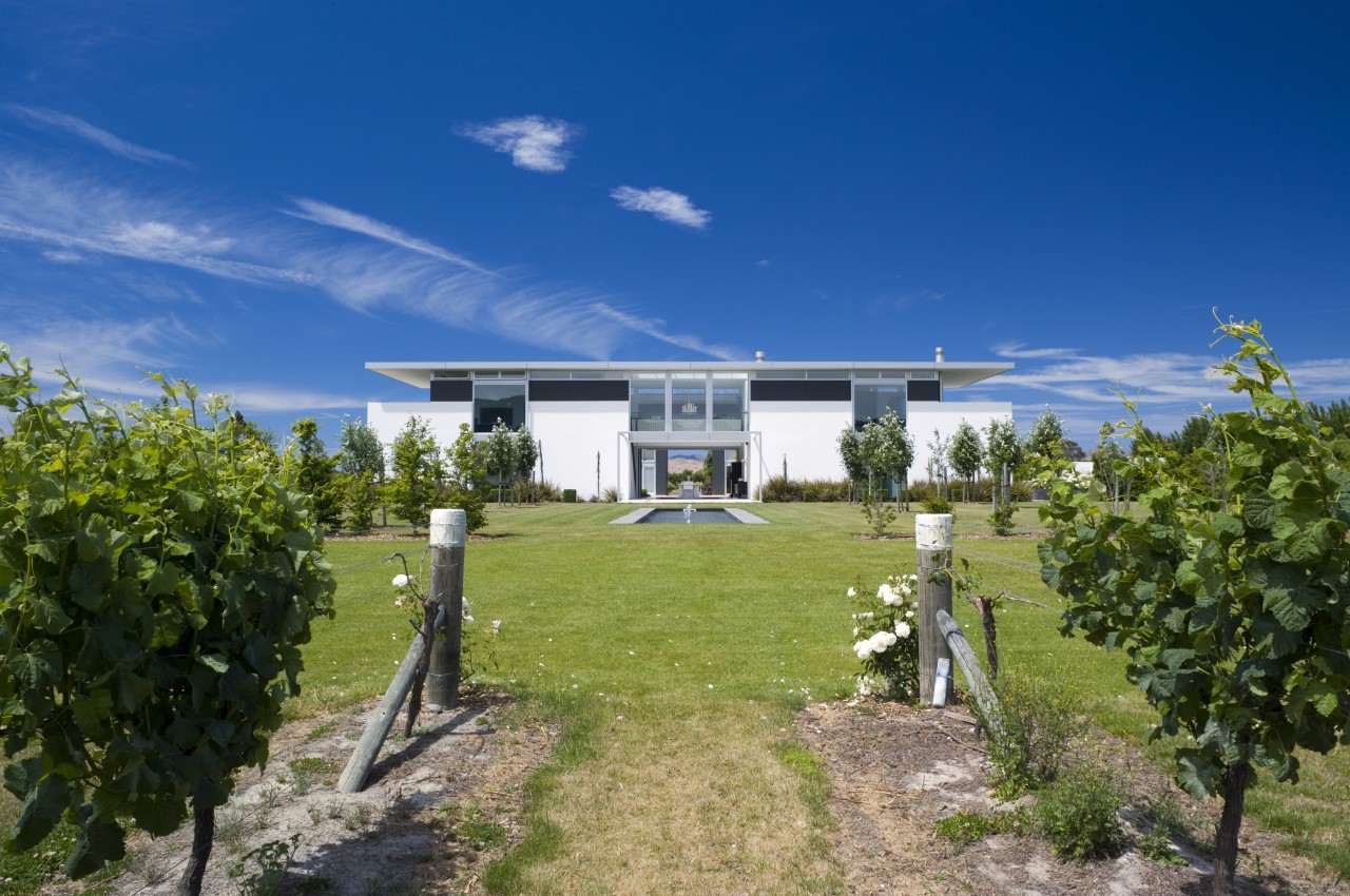 An exterior view of the entire home, vineyard. cloud, cottage, estate, facade, farmhouse, home, house, land lot, plantation, property, real estate, residential area, sky, tree, villa, blue