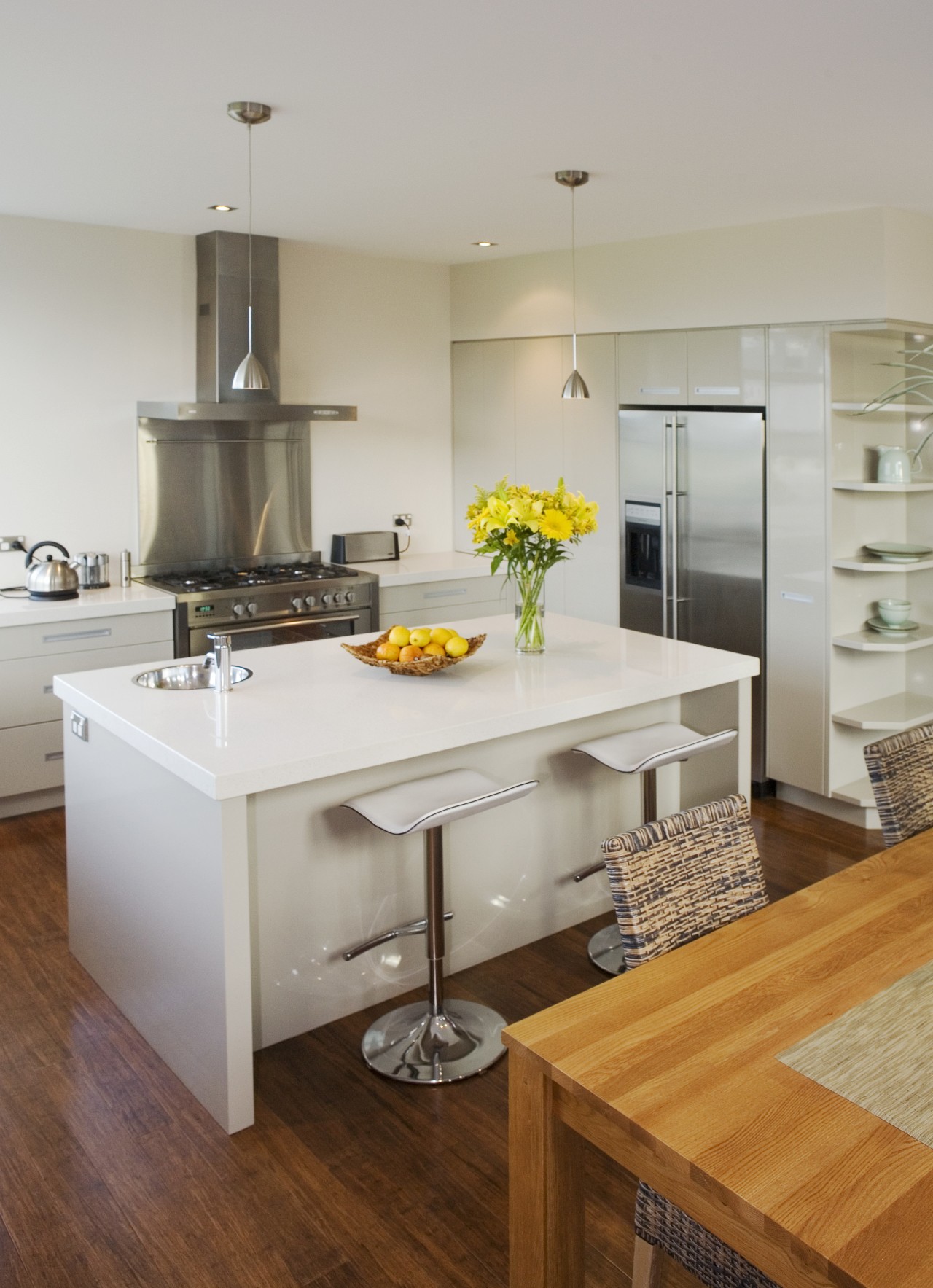 View of kitchen designed by Kitchens by Pat cabinetry, countertop, cuisine classique, floor, flooring, hardwood, interior design, kitchen, laminate flooring, room, wood flooring, gray