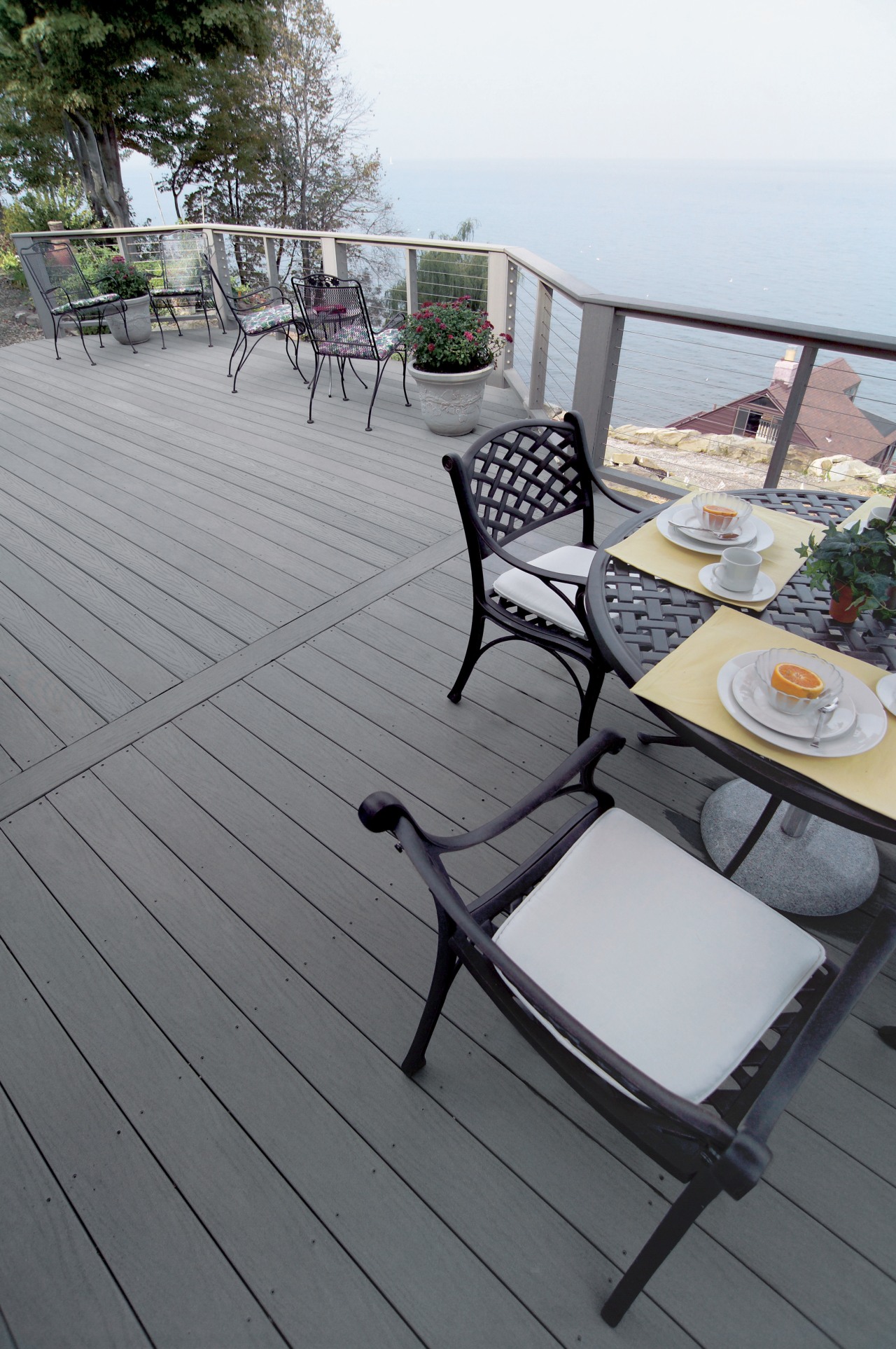 View of products from WeatherBest Decking &amp; Railing. chair, deck, floor, furniture, outdoor furniture, outdoor structure, sunlounger, table, wood, gray