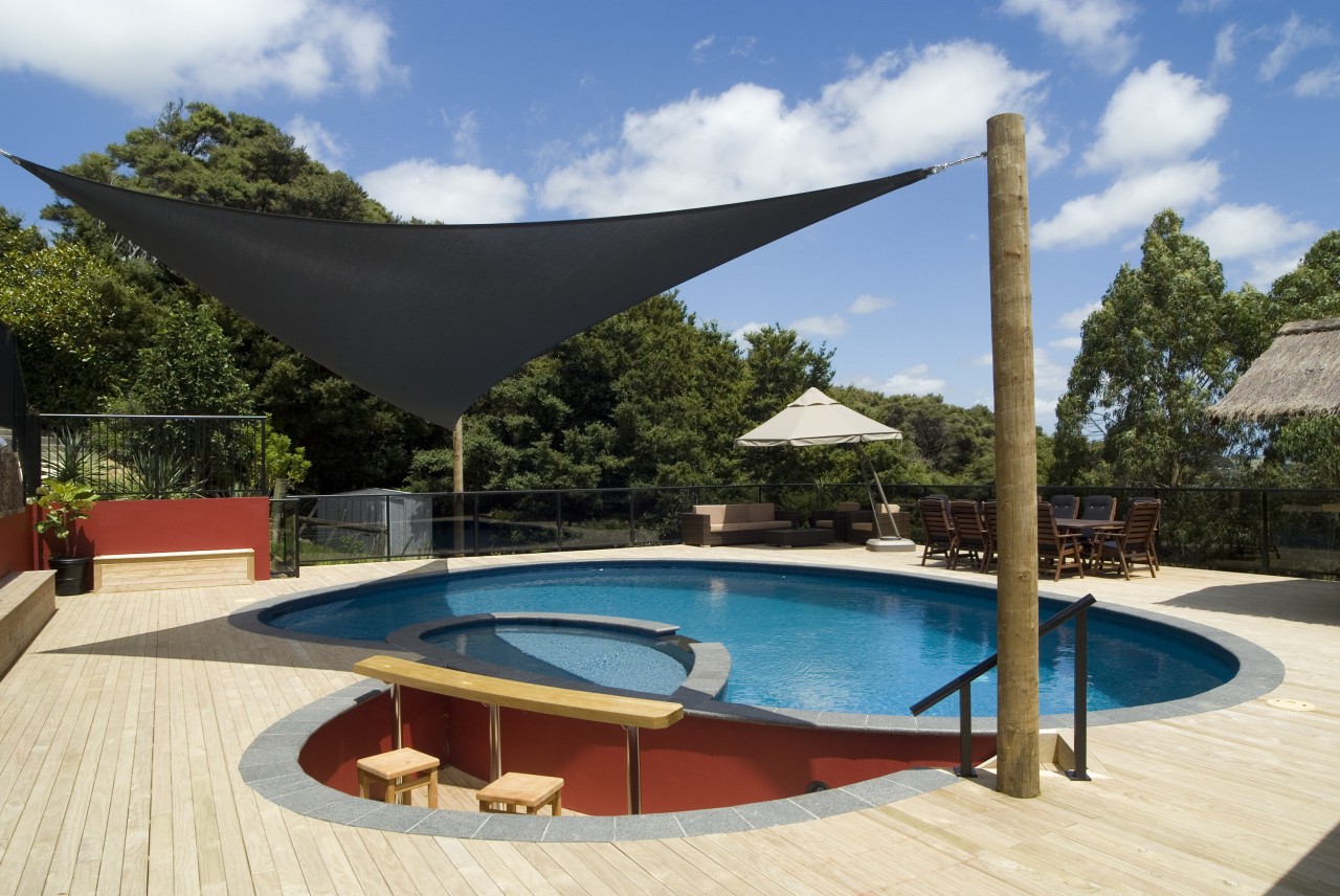view of a pool built by Mayfair Pools. estate, leisure, outdoor furniture, outdoor structure, property, real estate, resort, shade, sunlounger, swimming pool, villa